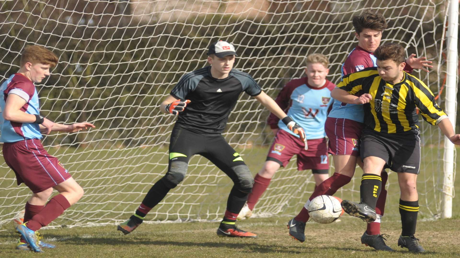 Action in the penalty area as Rainham Eagles (yellow) and Wigmore Youth Athletic fight for Division 3 points Picture: Steve Crispe