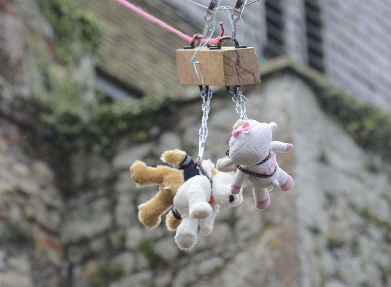 Teddy bears decend the zipline