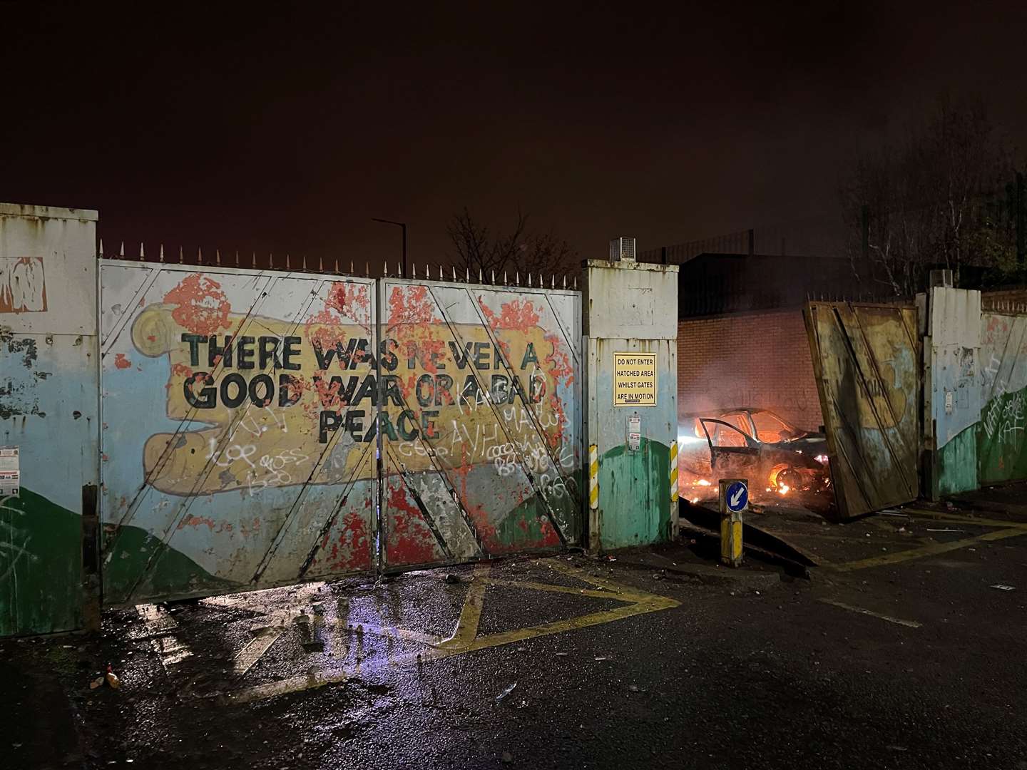 A car on fire at the Peace Gates in Lanark Way, Belfast (Liam McBurney/PA)