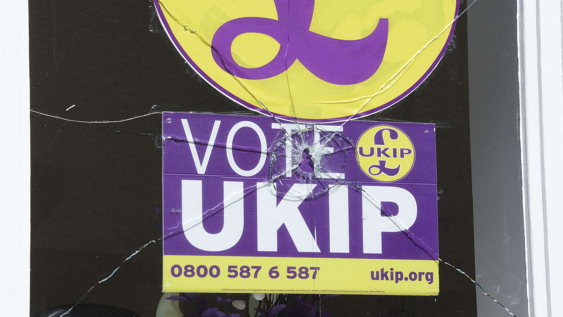 The smashed window at Ukip's Folkestone offices