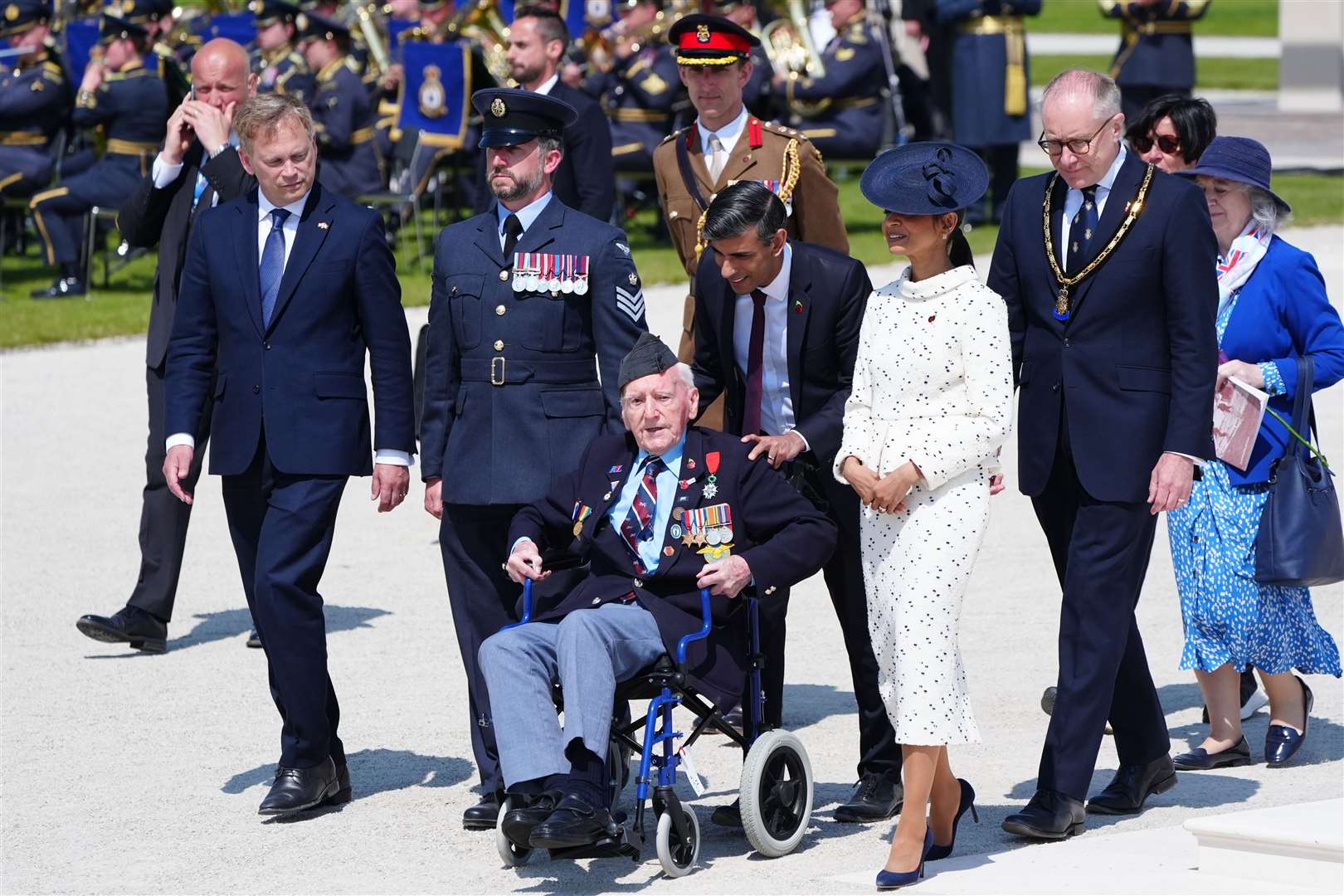 Prime Minister Rishi Sunak and wife Akshata Murty with RAF veteran Bernard Morgan, 100, from Crewe, Defence Minister Grant Shapps (left) and national chairman, Royal British Legion, Jason Coward (right) at the end of the UK national commemorative event for the 80th anniversary of D-Day, held at the British Normandy Memorial in Ver-sur-Mer, Normandy (Jane Barlow/PA)