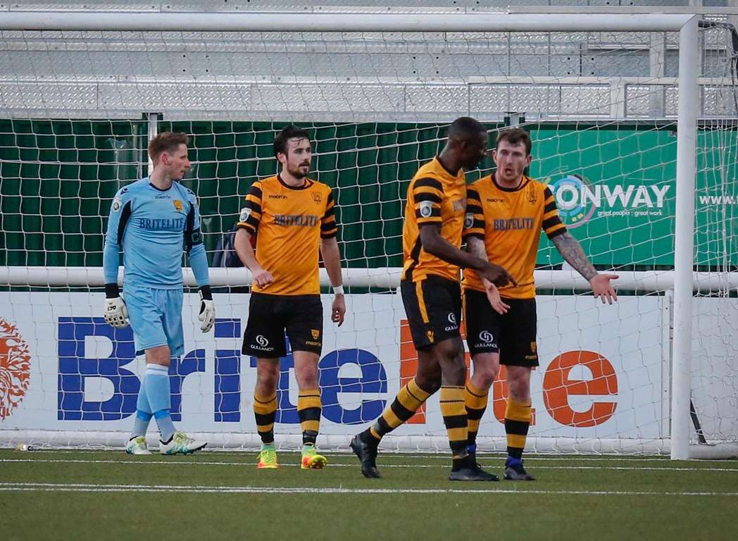 Anthony Acheampong and Reece Prestedge discuss Aldershot's second goal as Lee Worgan and Tom Mills look on Picture: Matthew Walker