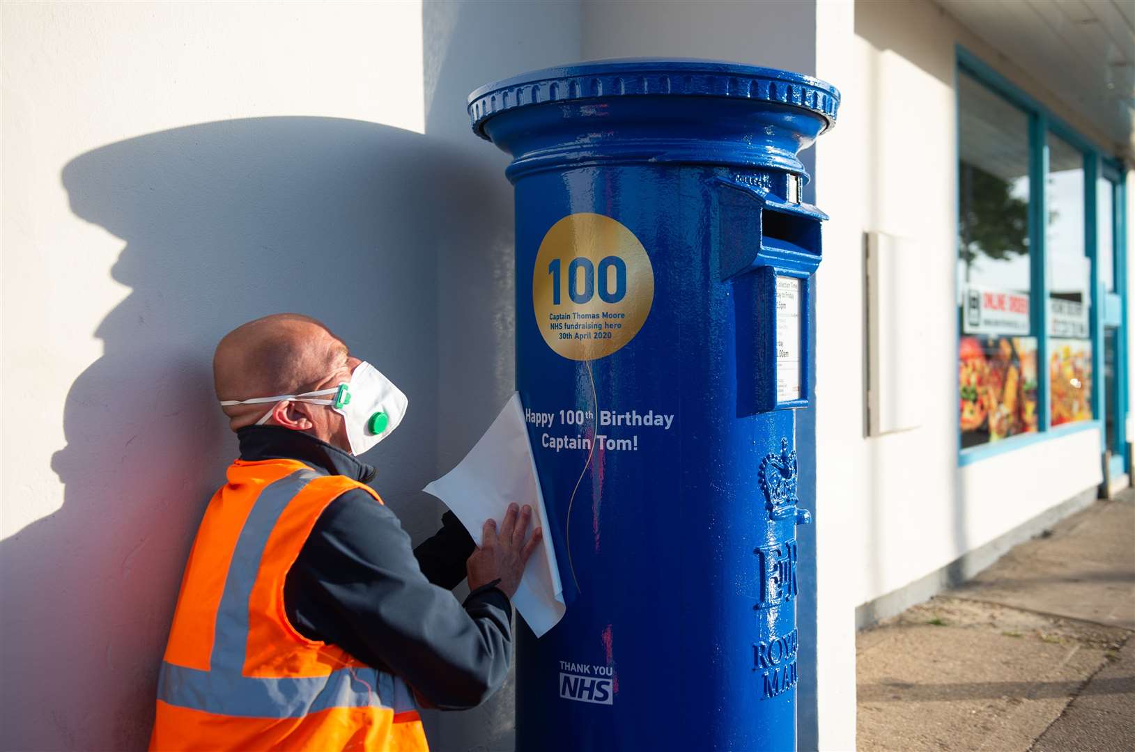 A postbox was painted blue to mark the 100th birthday of Sir Tom close to the home in Marston Moretaine (PA)