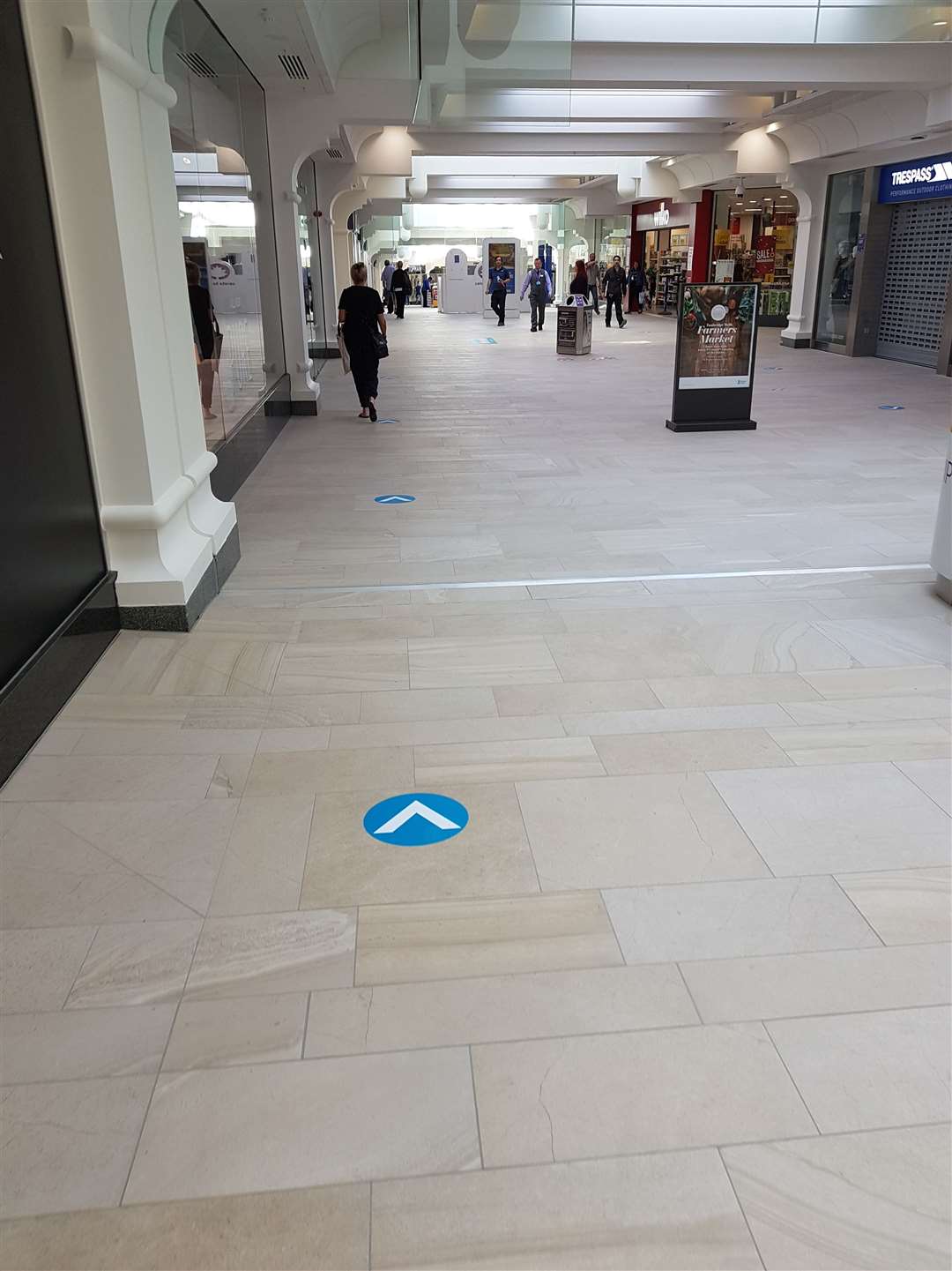 One-way signs on the floor of the Royal Victoria shopping mall in Tunbridge Wells