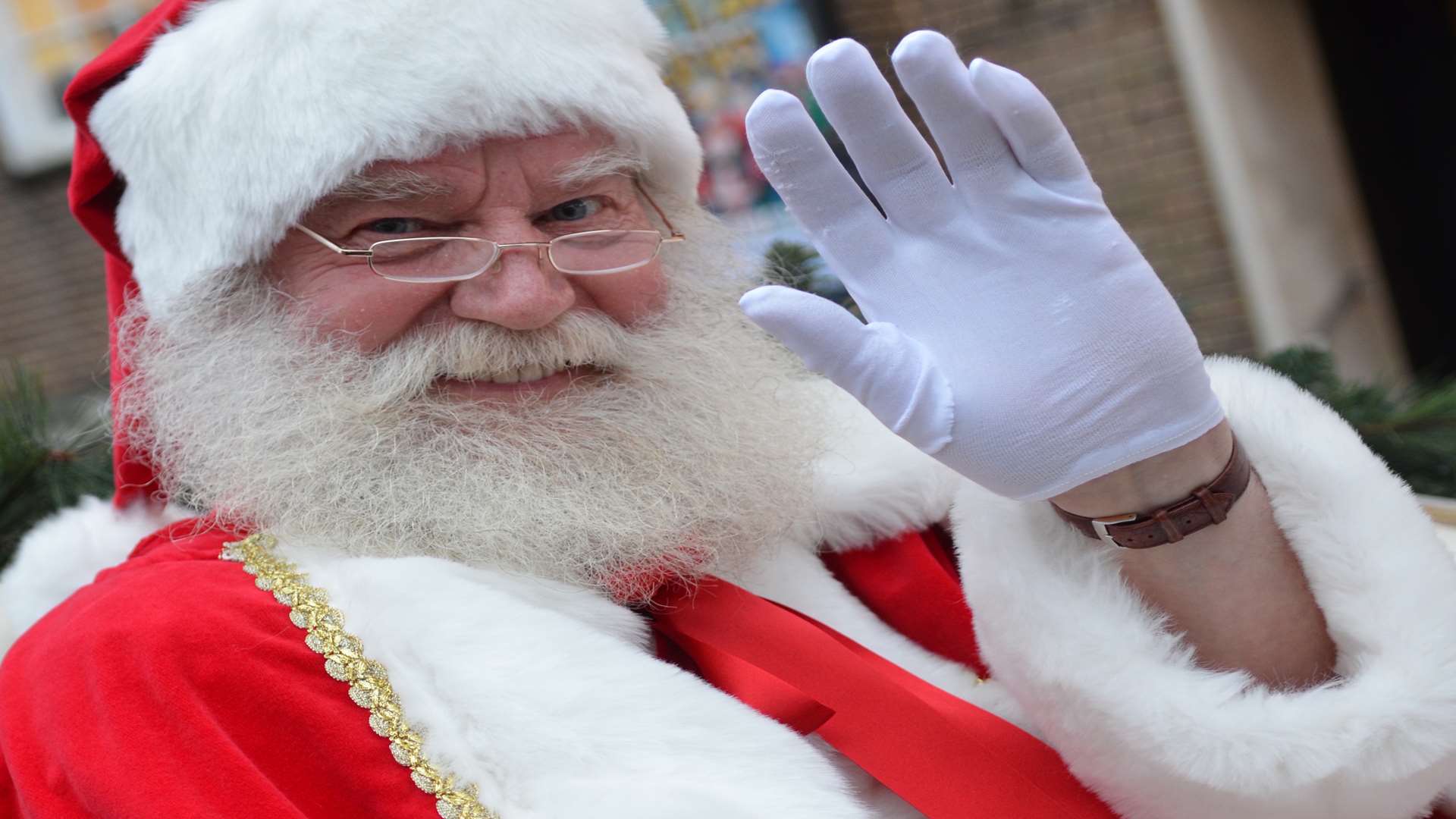 Father Christmas waves to the crowds at the lights switch on