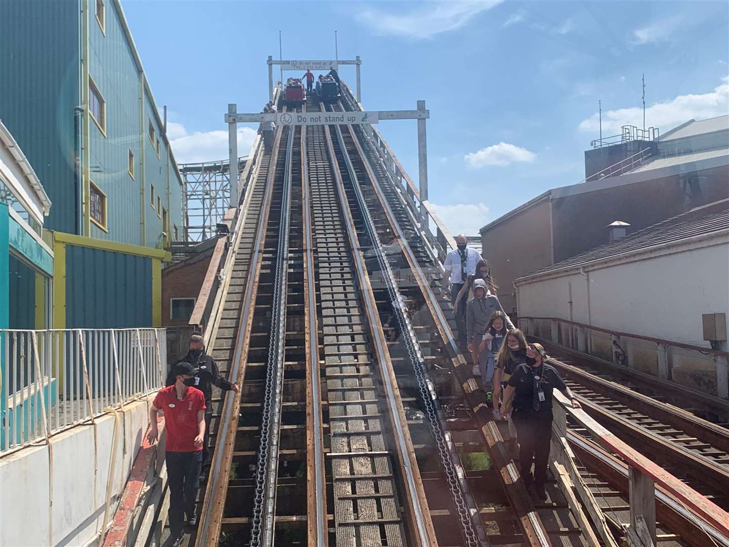 Visitors are helped down from the Grand National rollercoaster ride at Blackpool Pleasure Beach, Lancashire (Owen Humphreys/PA)