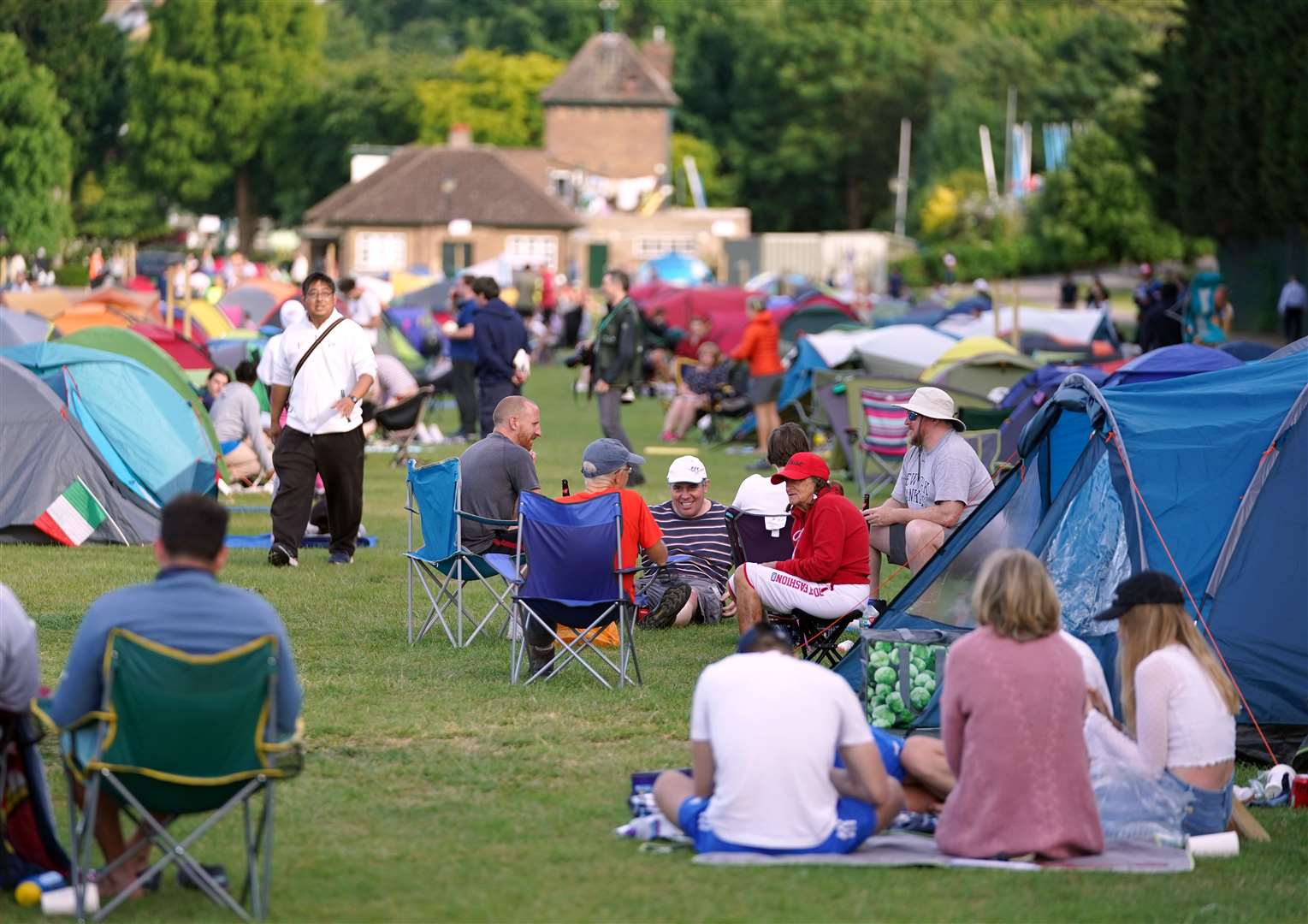 Campers form the overnight queue ahead of the first day of play at Wimbledon (PA)