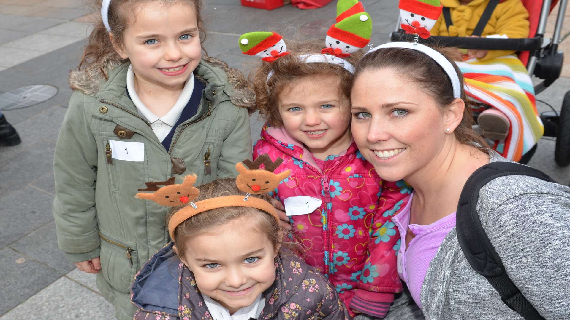 Sisters Marcella, Stella and Alessia with their dance teacher Hannah May enjoying the fun in Community Square