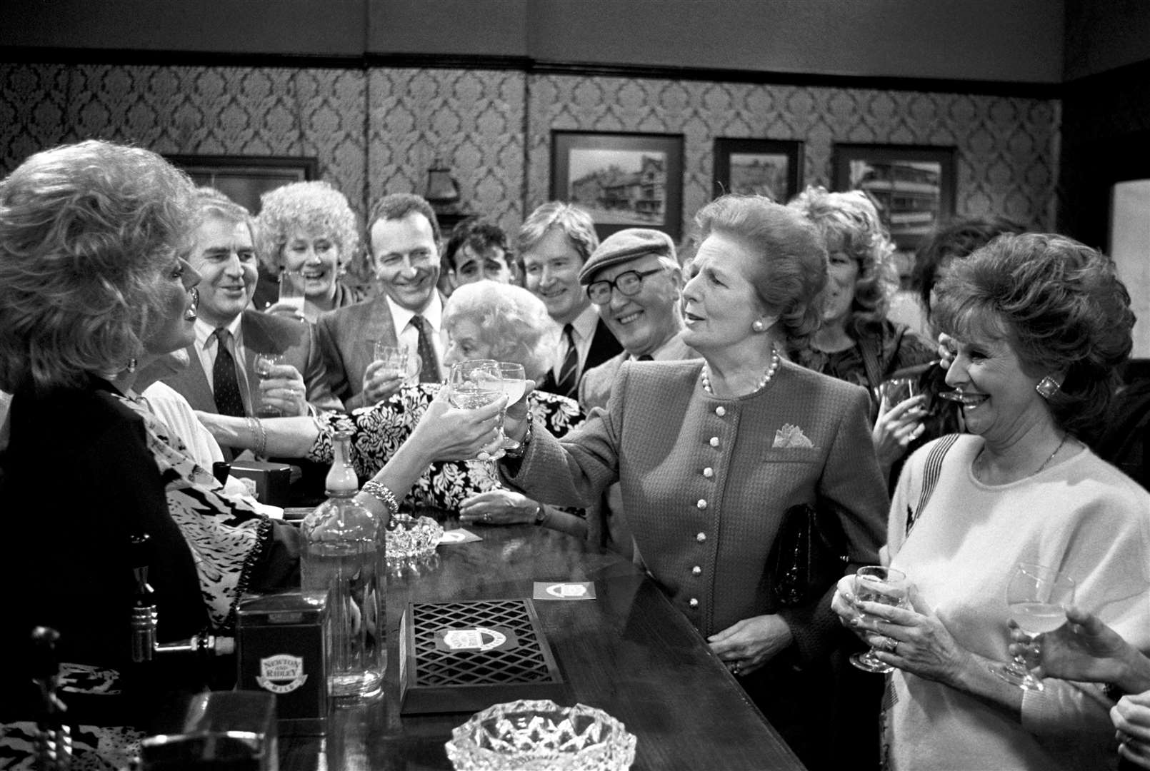 Margaret Thatcher toasts Julie Goodyear and the cast of Coronation Street when she visited the Rovers Return at Granada Television Studios in Manchester (PA Archive)