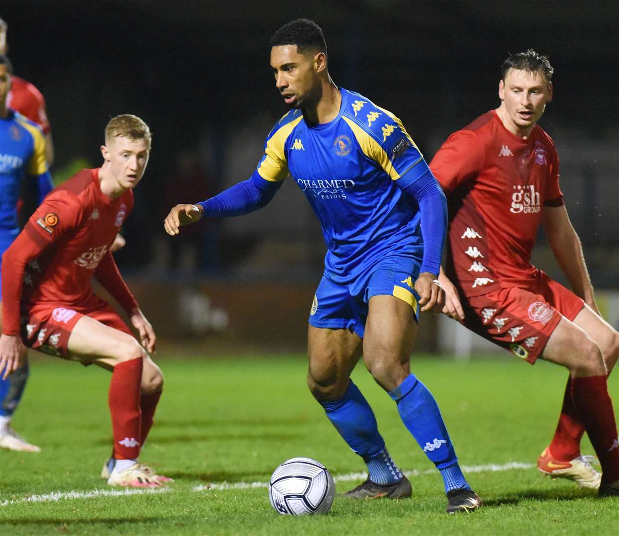 Gold Omotayo on the ball for King's Lynn as Dover's Goodman and Ryan Hanson watch on. Picture: Tim Smith