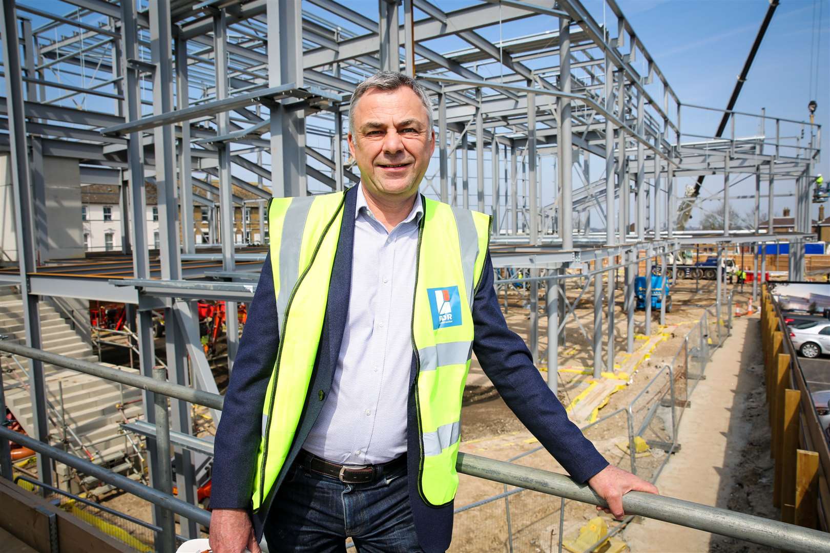 Keith Pullinger of The Light Cinema chain in front of the building site opposite Sittingbourne Railway Station