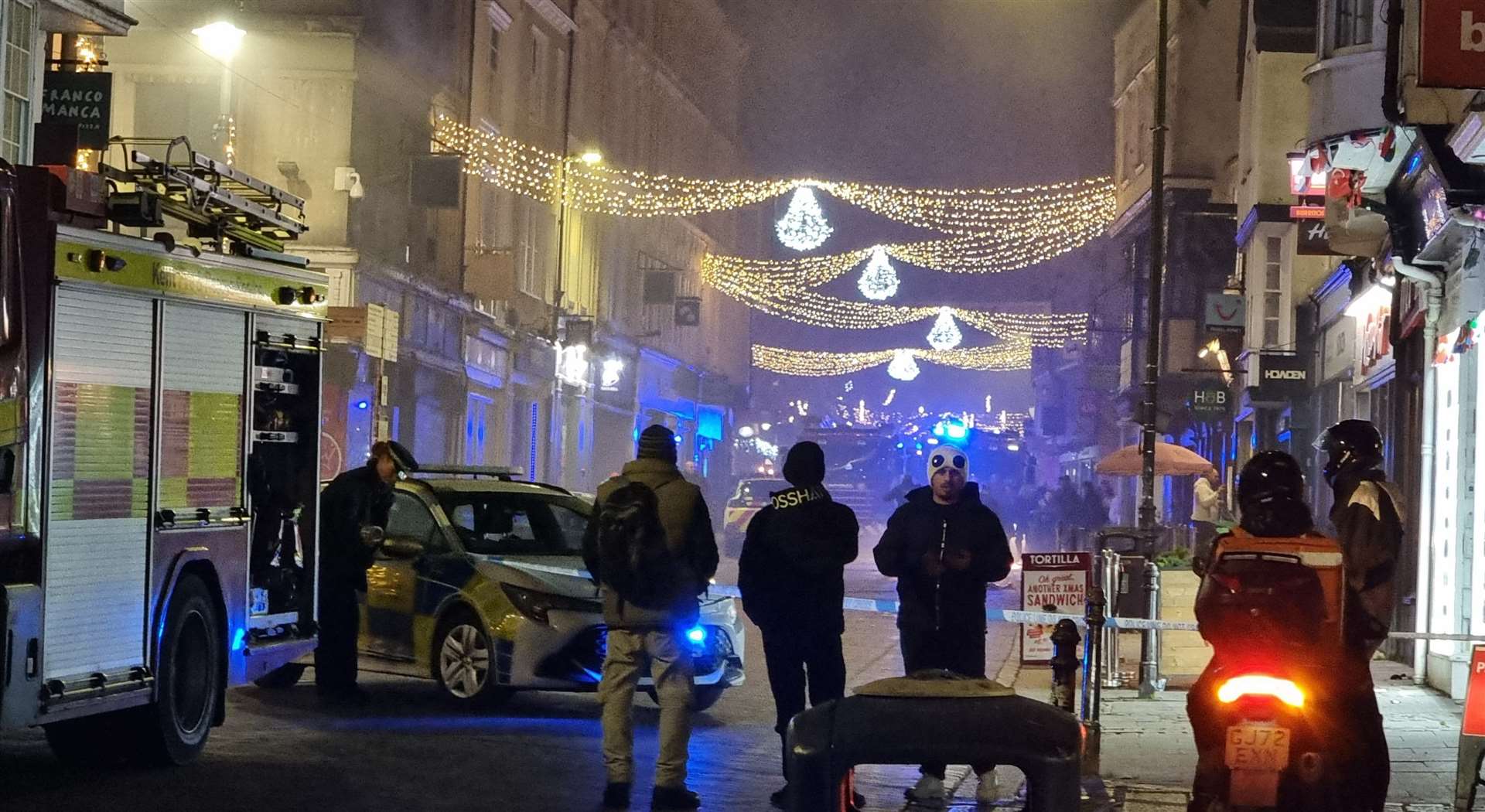 Bystanders look on as the emergency services respond to reports of a fire in Canterbury High Street. Picture: Lukas Järvinen