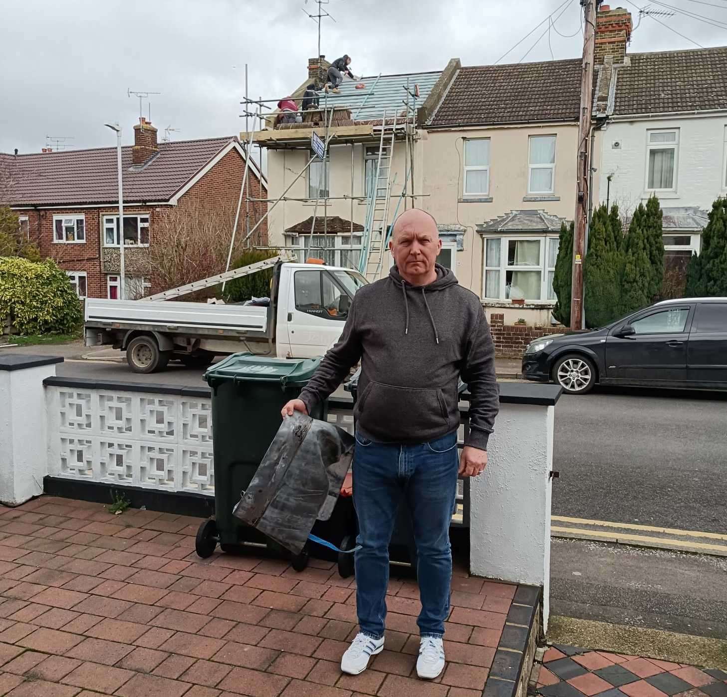 Mr Fitzgibbon with the sheet of lead that landed on the bin seconds after he moved it