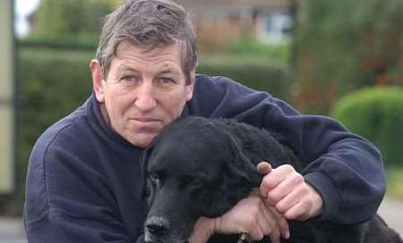 REUNITED: Holly gets a cuddle from her owner David White. Picture: MATT WALKER