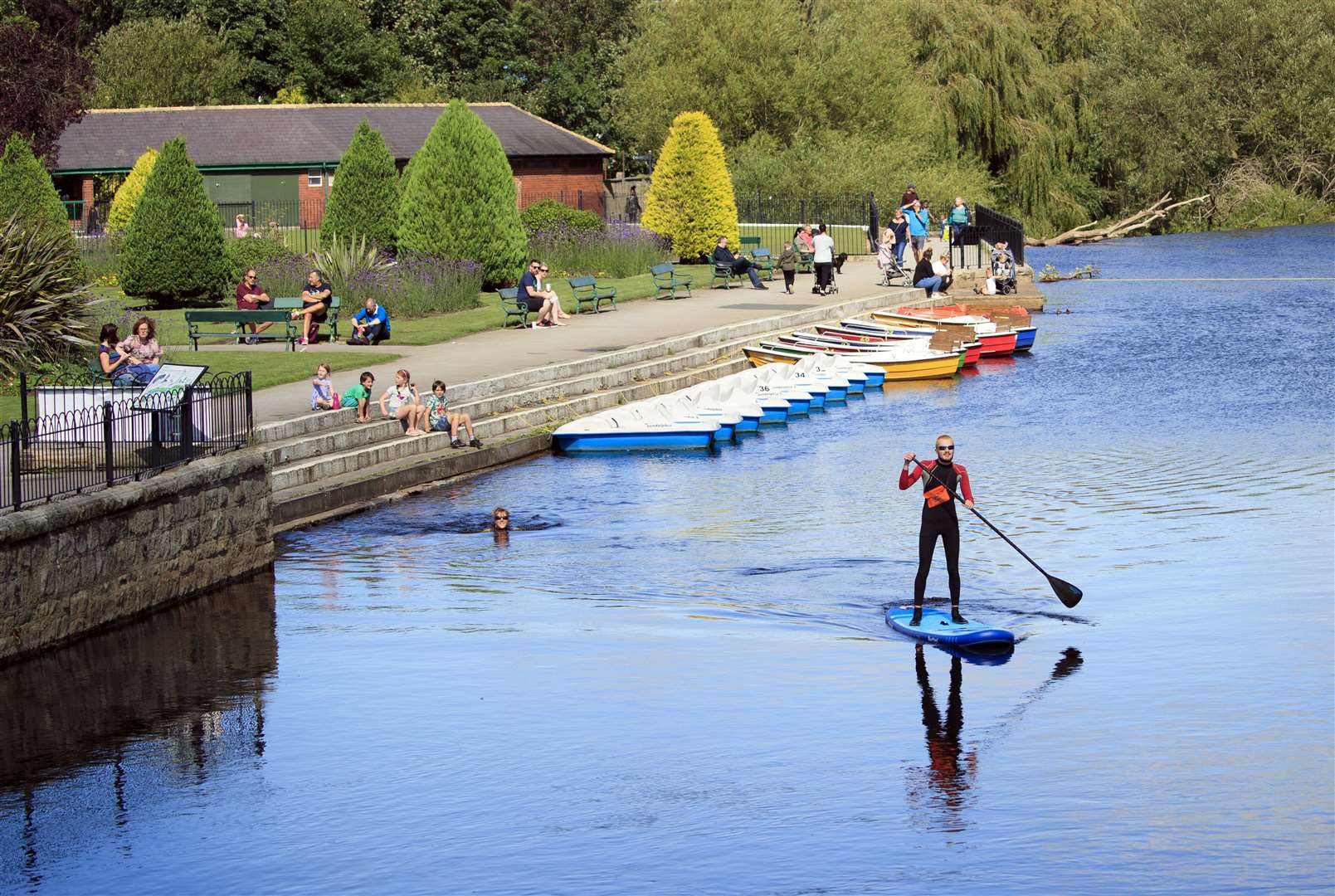 A paddleboarder enjoys the sun on the River Wharfe near Otley in West Yorkshire (PA)