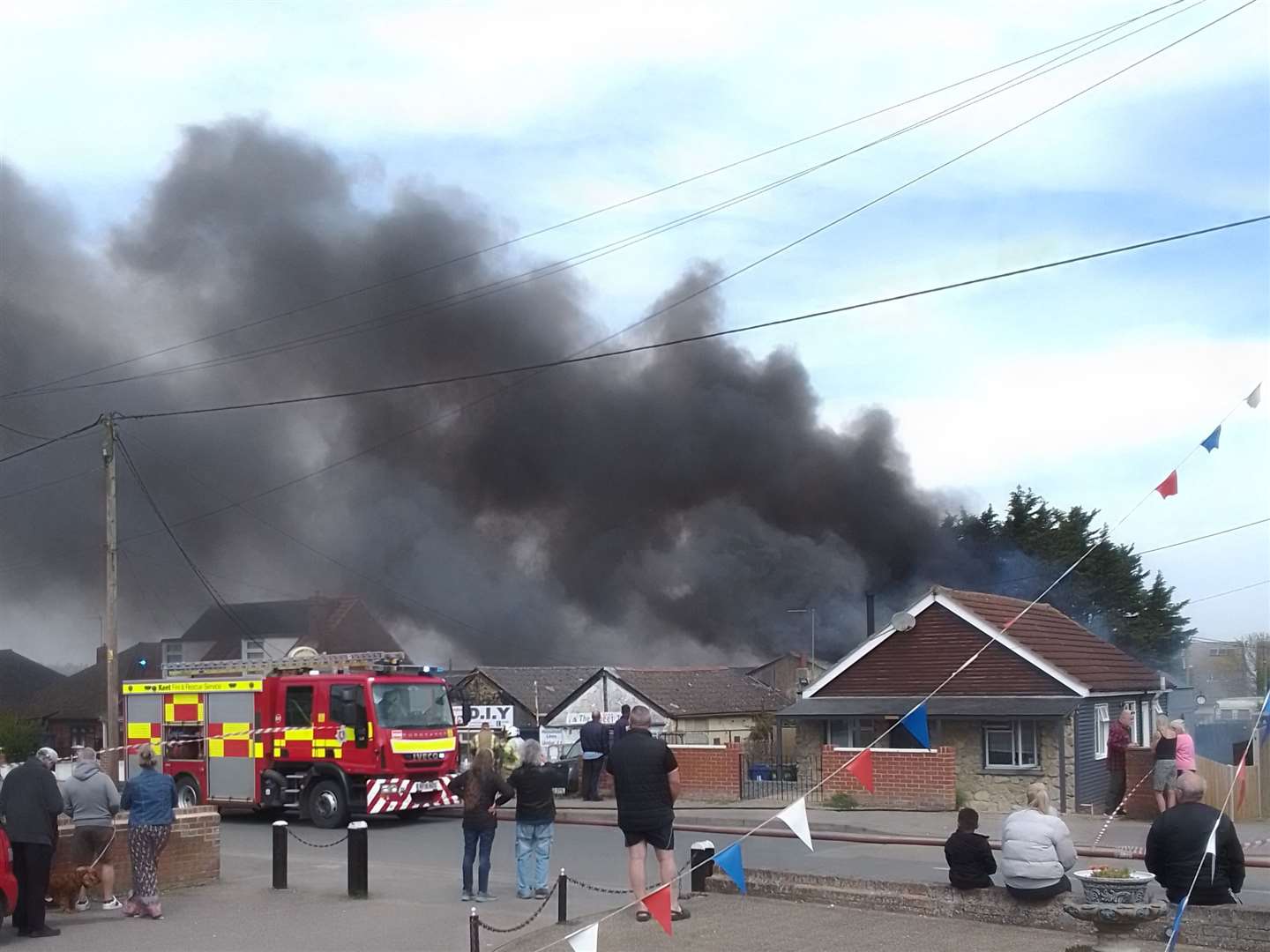 Black smoke can be seen coming from the property