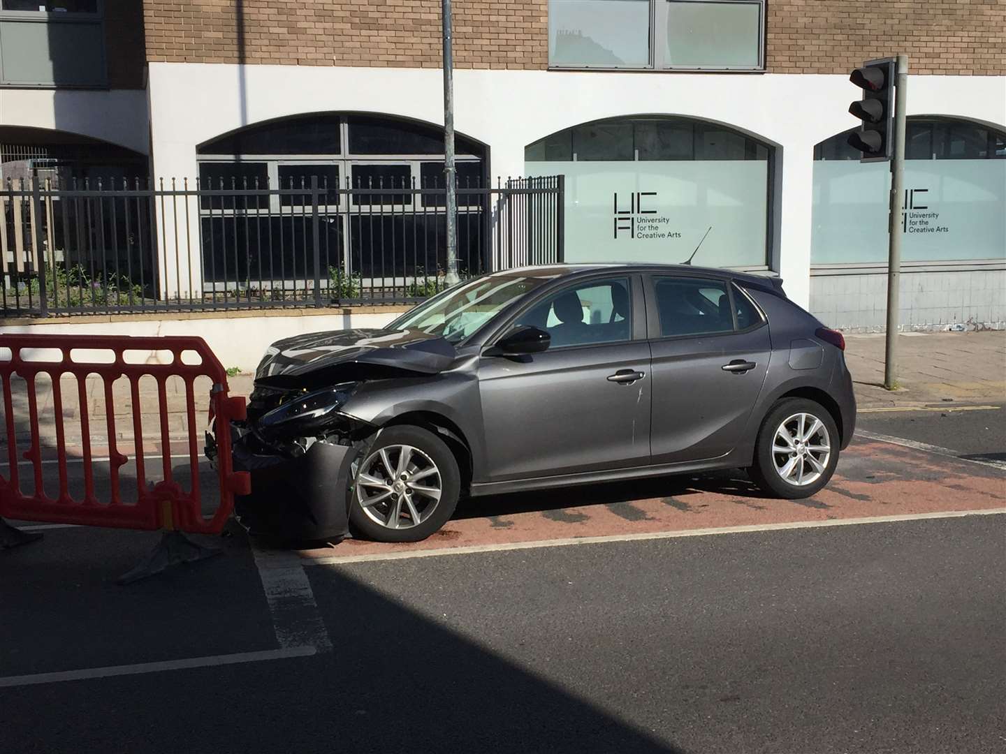 Police are at the scene of a crash involving two cars in Upper Chantry Lane, Canterbury, near the traffic lights by Waitrose and Premier Inn in New Dover Road