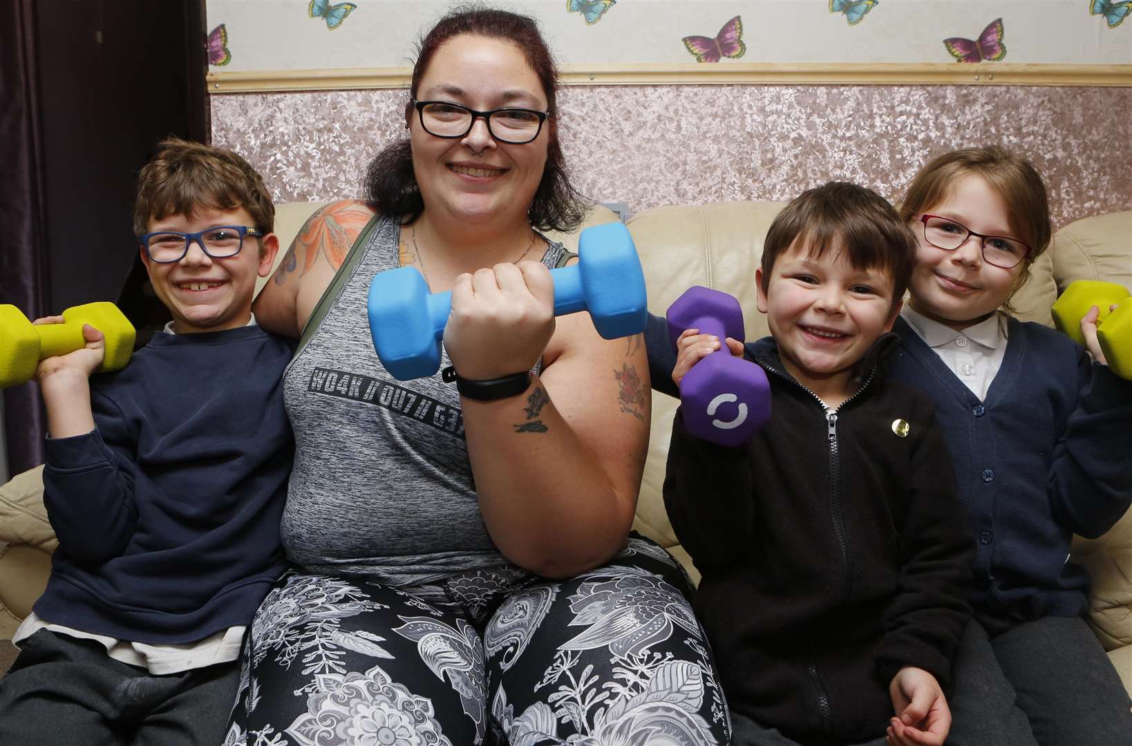 Donna King pumps iron with children Callum, Oscar, and Sophie