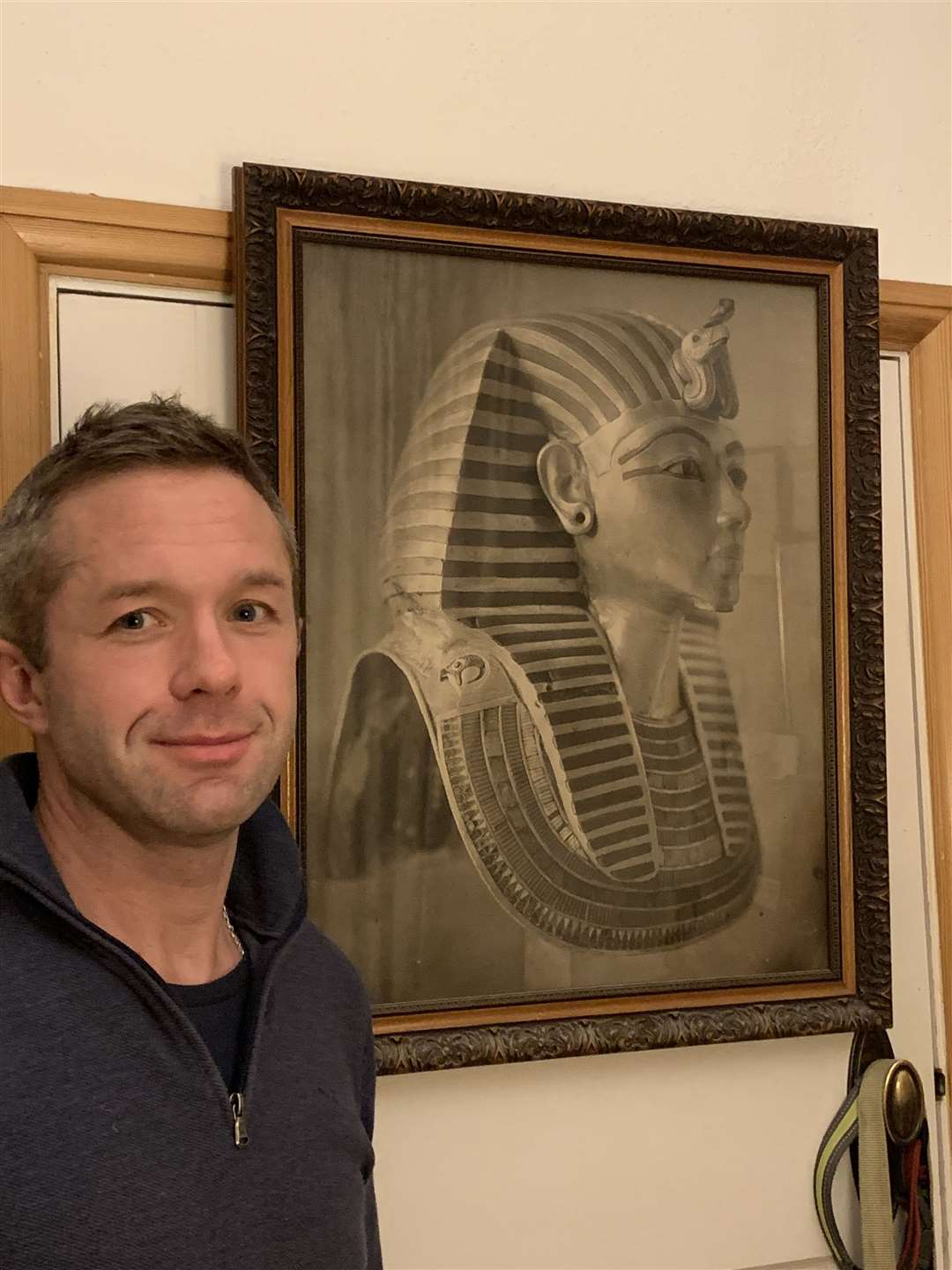 James Lovegrove with a picture of the King's death mask behind him