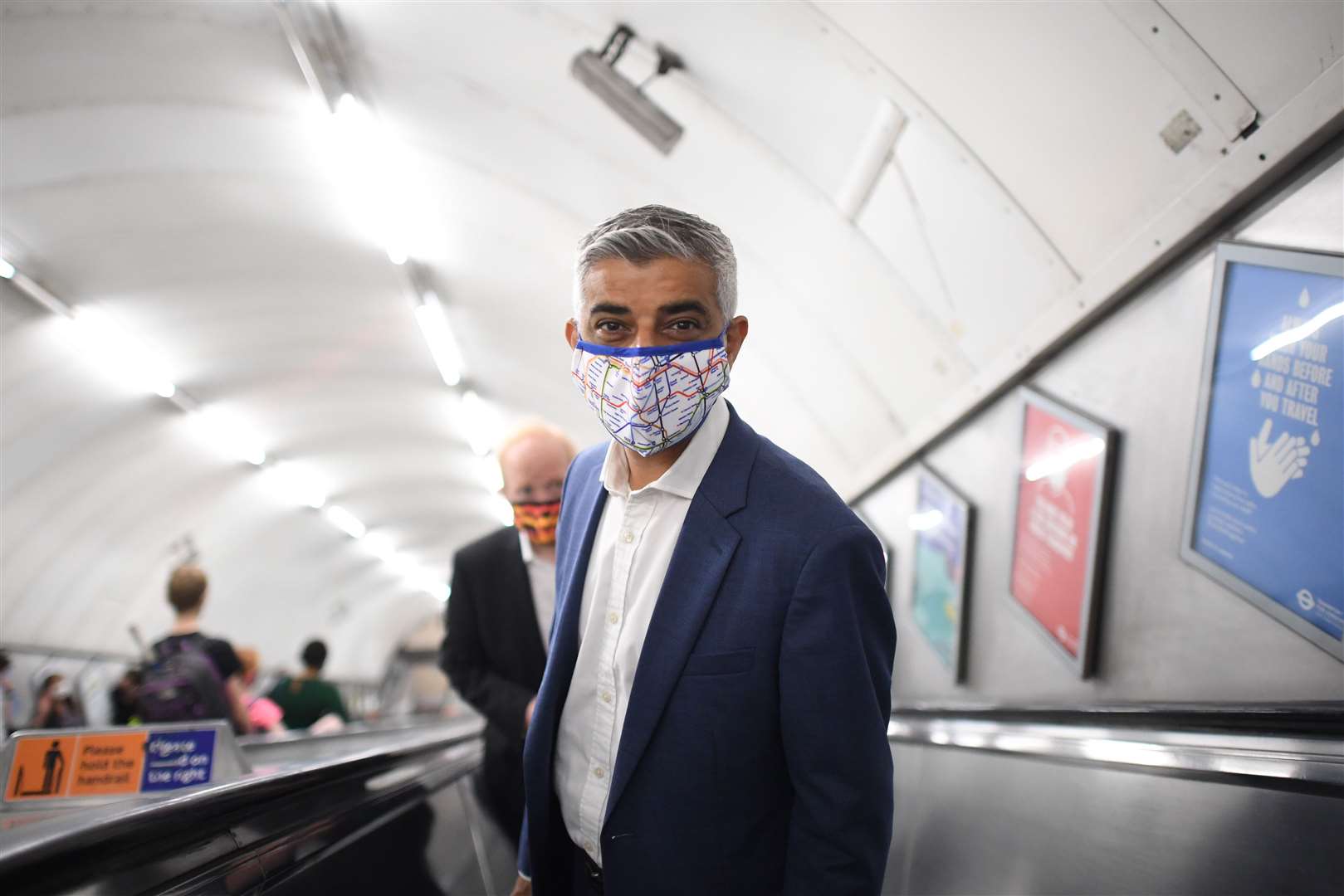 Face coverings are still required on public transport in London, excluding those with exemptions, due to a push by Mayor Sadiq Khan (Stefan Rousseau/PA)