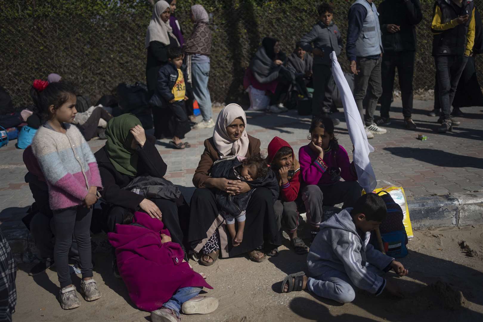 Palestinians arrive in the southern Gaza town of Rafah after fleeing an Israeli ground and air offensive in the nearby city of Khan Younis (AP Photo/Fatima Shbair)