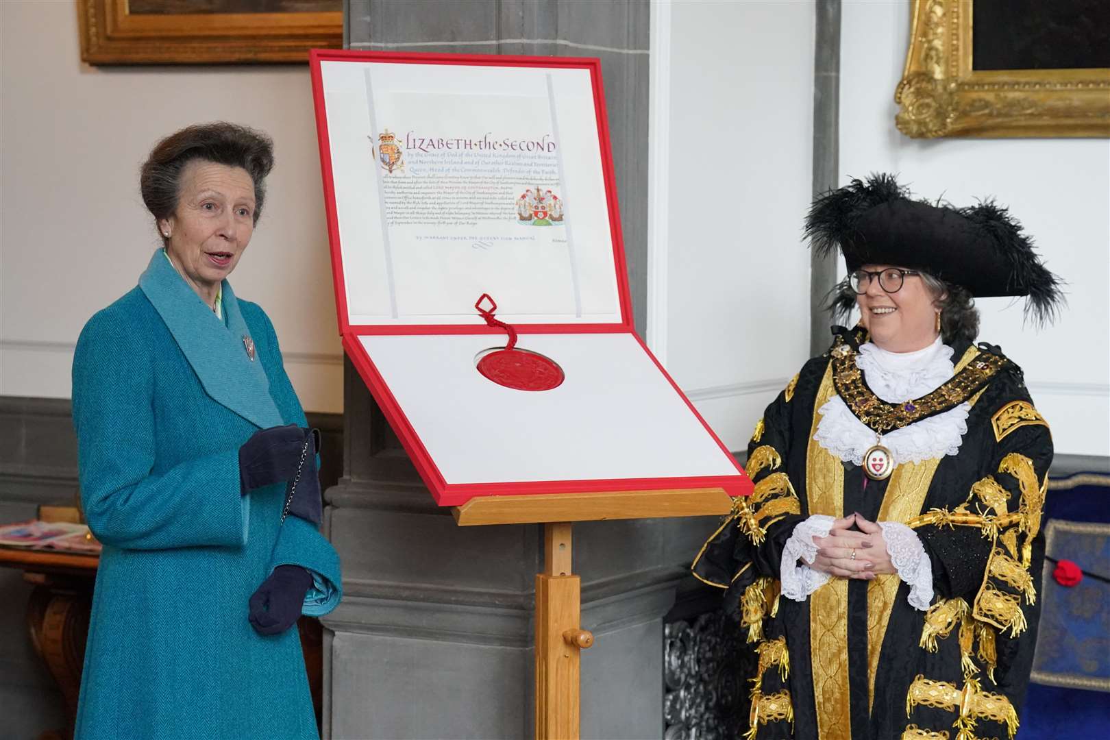 The Princess Royal presents the Letters Patent, bestowing Lord Mayoralty status on Southampton, to Councillor Jacqui Rayment, the Lord Mayor of Southampton (Jonathan Brady/PA)