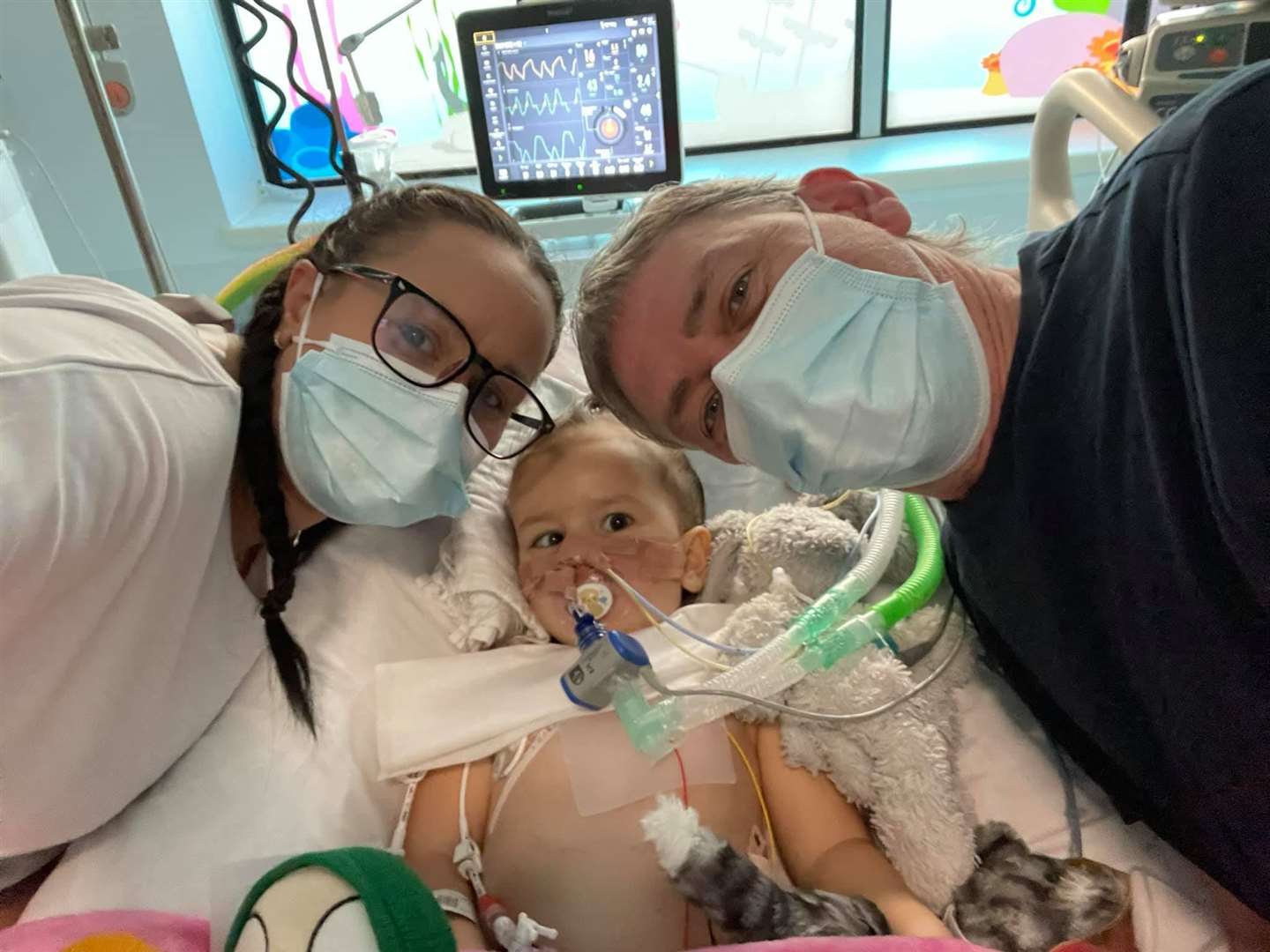 Lauren and Colin with Izzy before her surgery. Photo: Isobel's Army Facebook Page