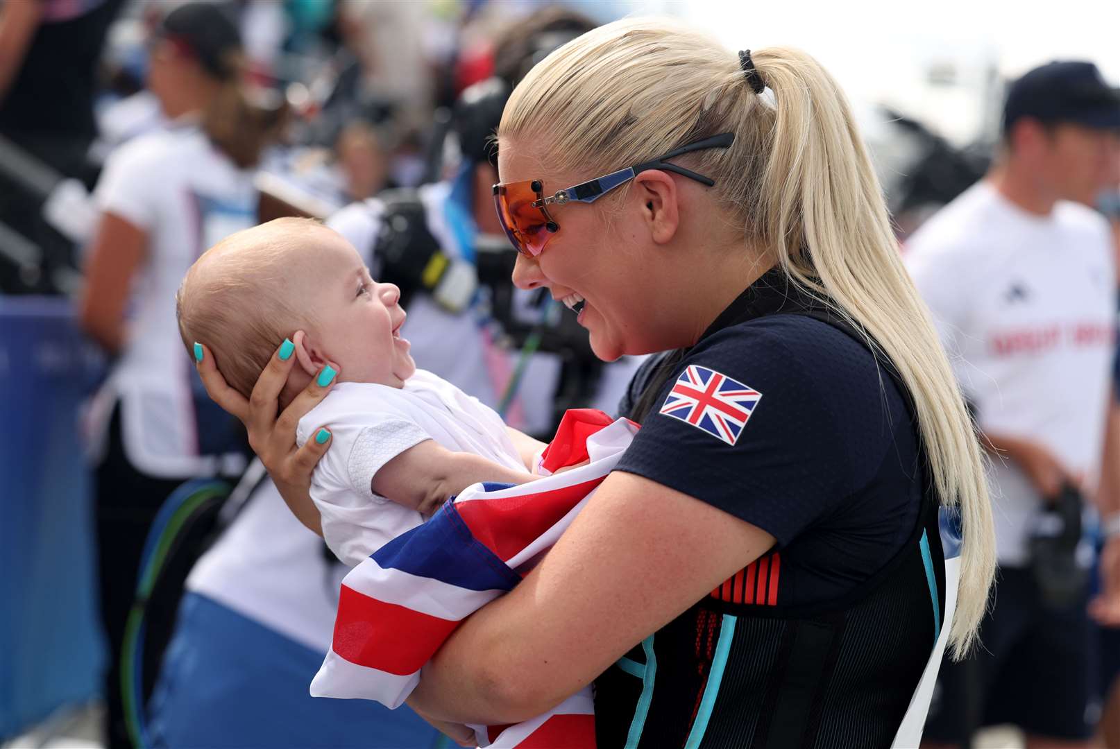 Amber Rutter with her son Tommy after winning a silver medal in the women’s skeet (Isabel Infantes/PA)