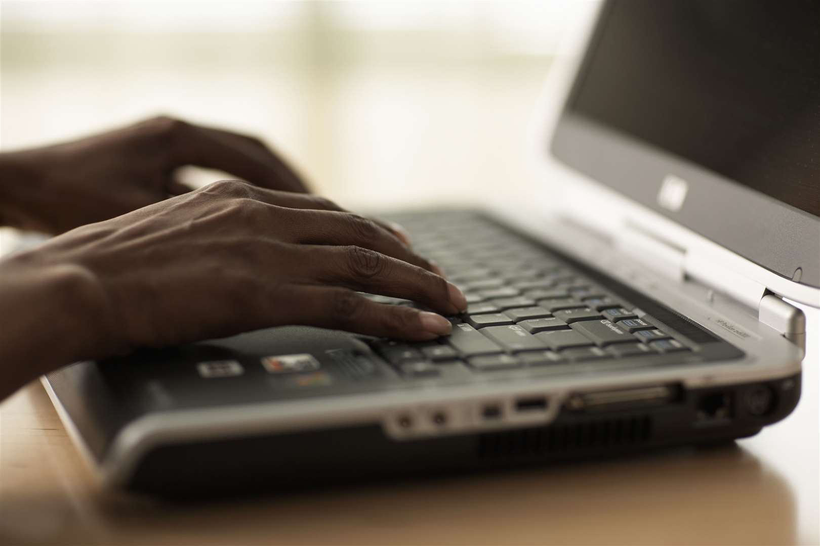 Senior woman using laptop, close-up of hands Silver surfer - stock image to accompany story on elderly computer classes (1011173)