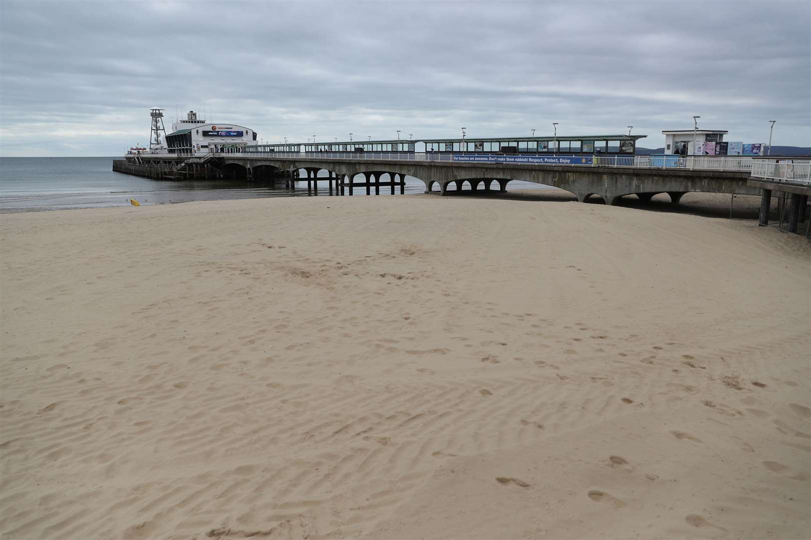 An empty beach and pier at Bournemouth in Dorset (Andrew Matthews/PA)