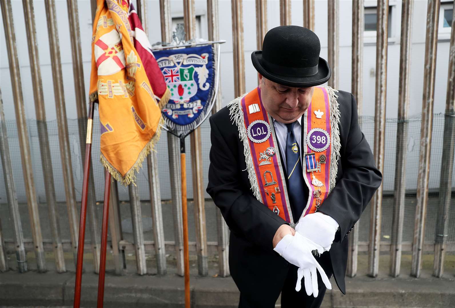 An Orange Order member ahead of a parade in Belfast, as part of the annual Twelfth of July celebrations (PA)