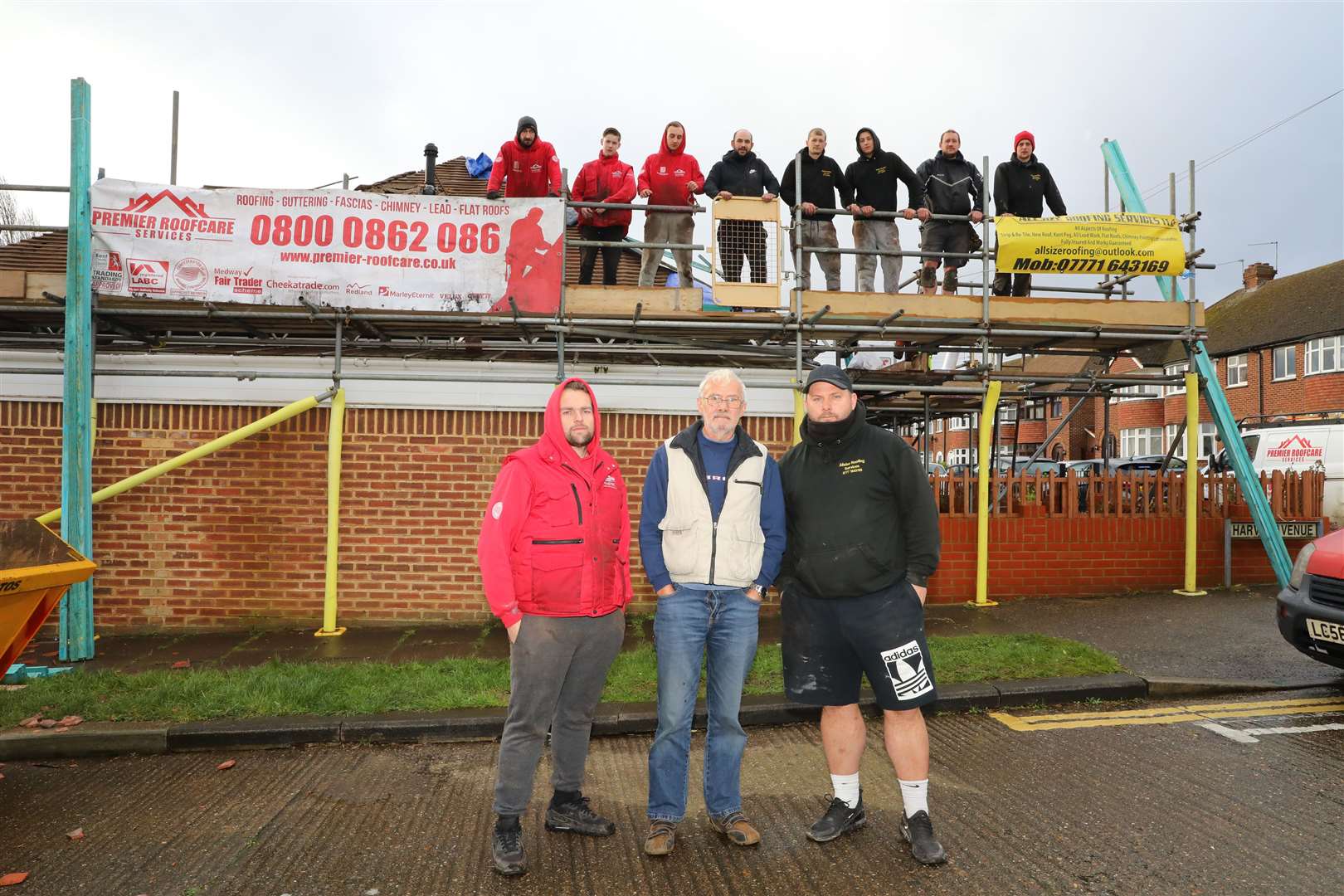 Lee Austin with Malcolm Bishop and Steve Weeks and the other tradesmen who went along to help