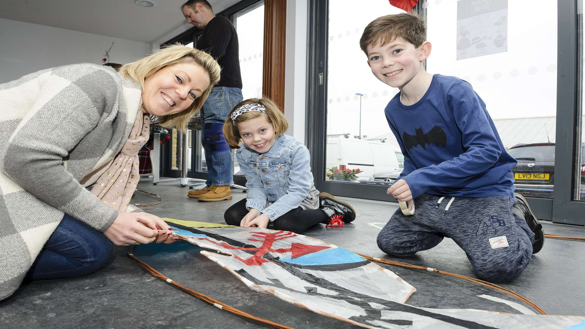 Gemma Myers, Lola Myers, seven, and Dougie Myers, 10, enjoy the workshop. Picture: Andy Payton