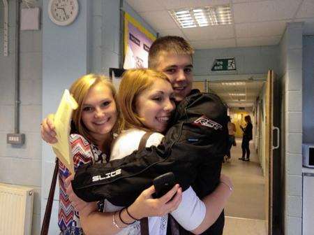 Chatham Grammar pupils Rhiannon smith, Charlotte wood AND Sam Slocombe congratulate each other