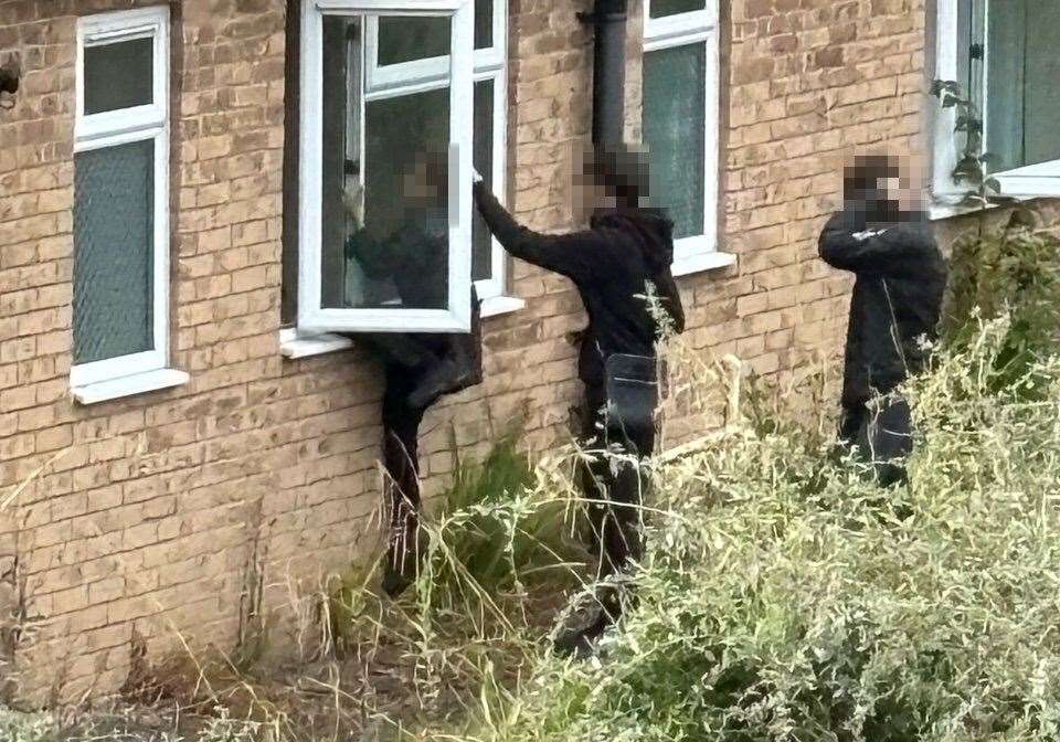 Children clambering into a window at one of the disused buildings of the former care home in Deal. Submitted picture