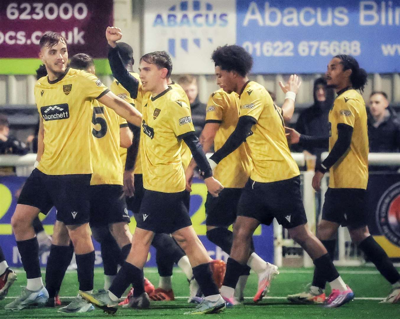 Matt Rush, centre, is congratulated after adding Maidstone's fourth. Picture: Helen Cooper