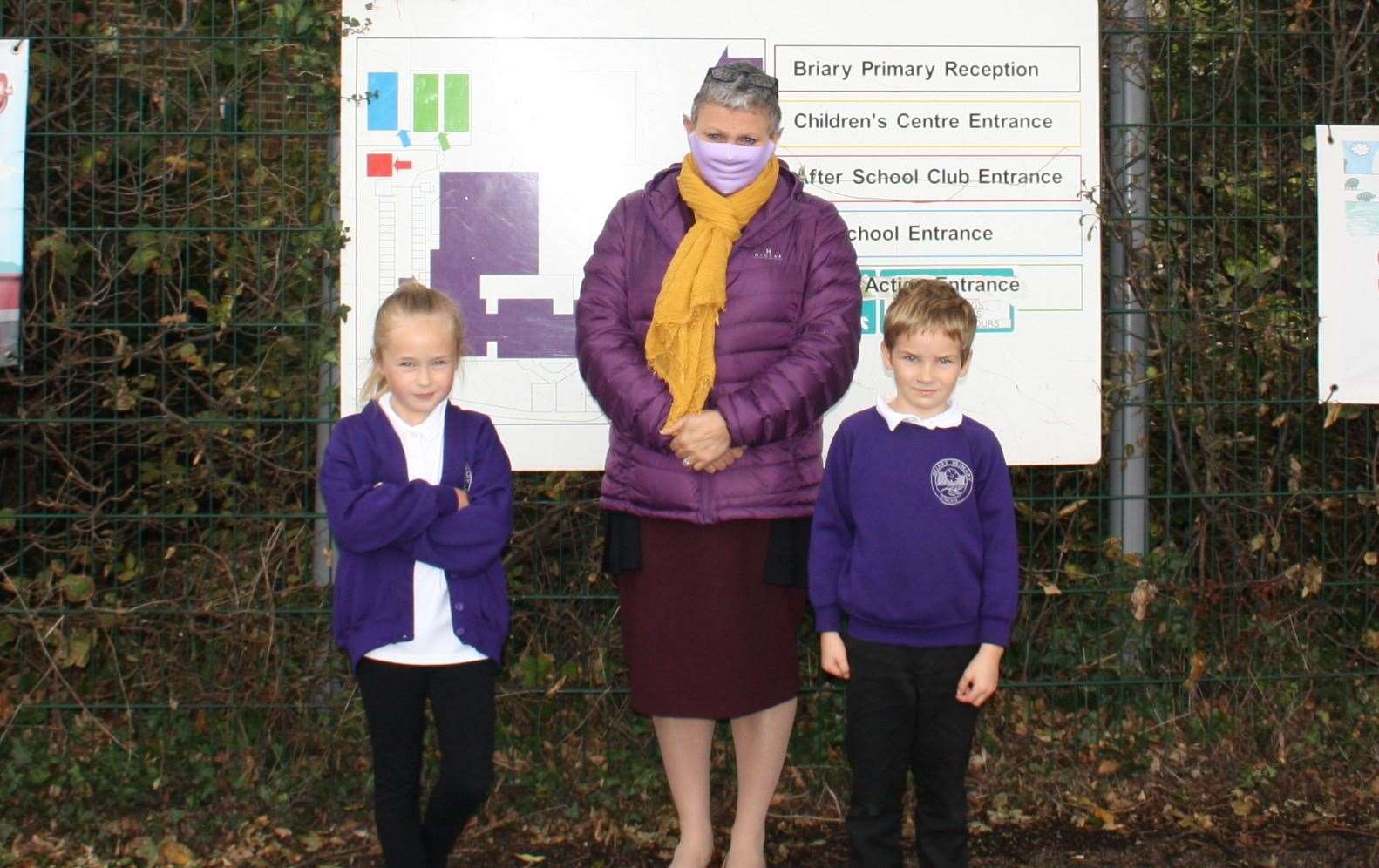 Briary Primary's head teacher Nicky Murrell with two pupils after the milk was stolen from outside the school's gates
