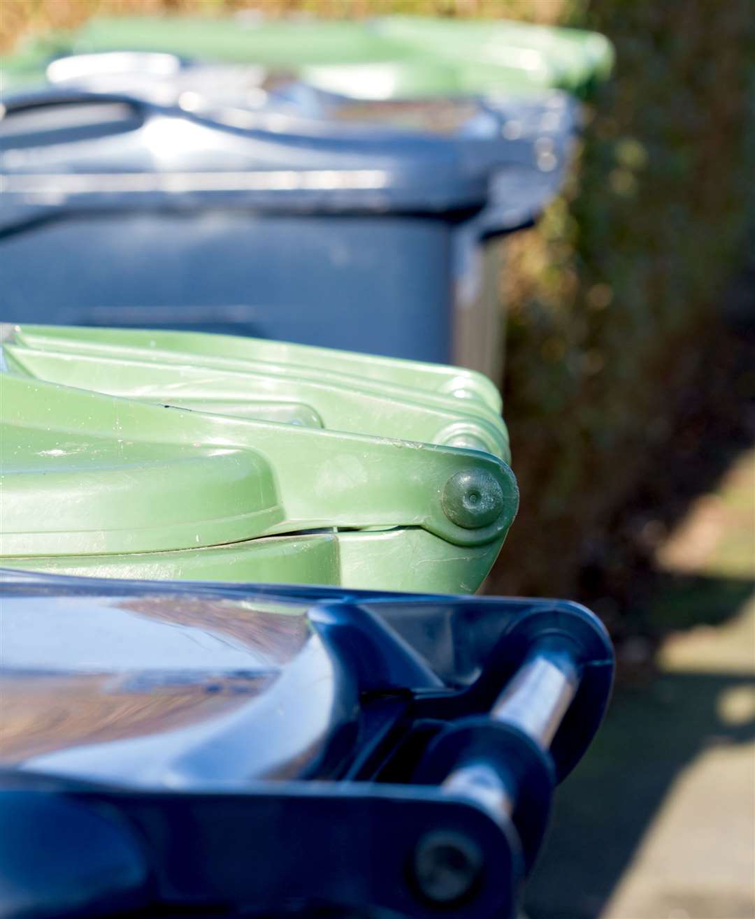 Line of wheelie bins waiting to be emptied. Stock picture