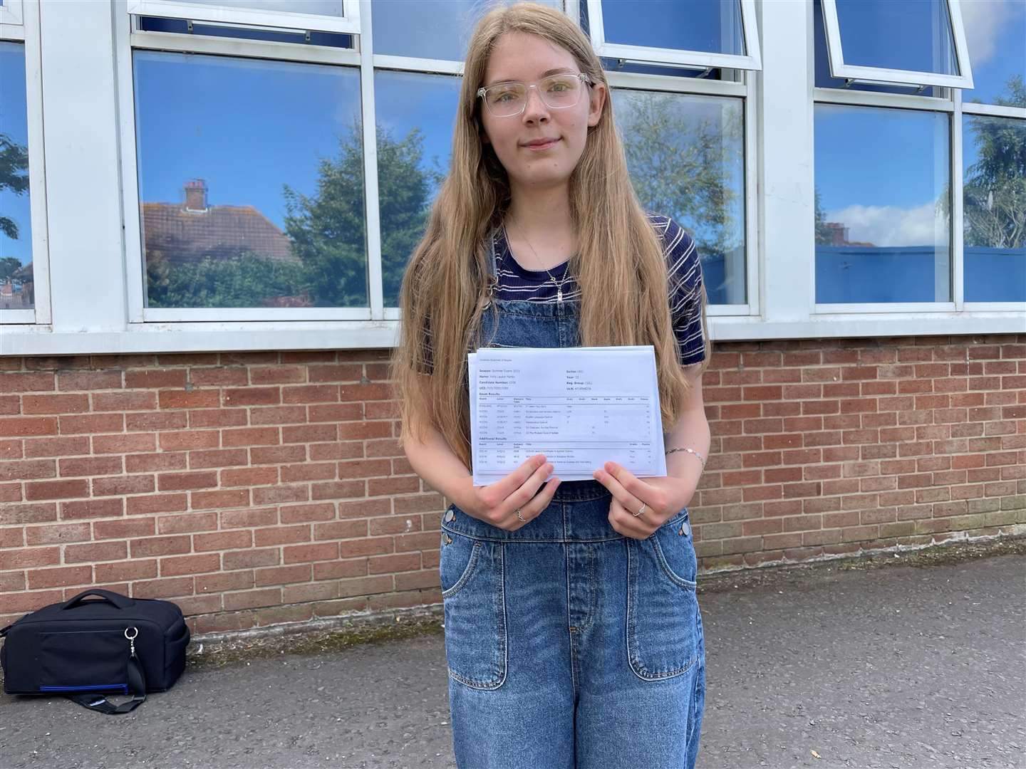 Holly Martin with her GCSE results (Jonathan McCambridge/PA)