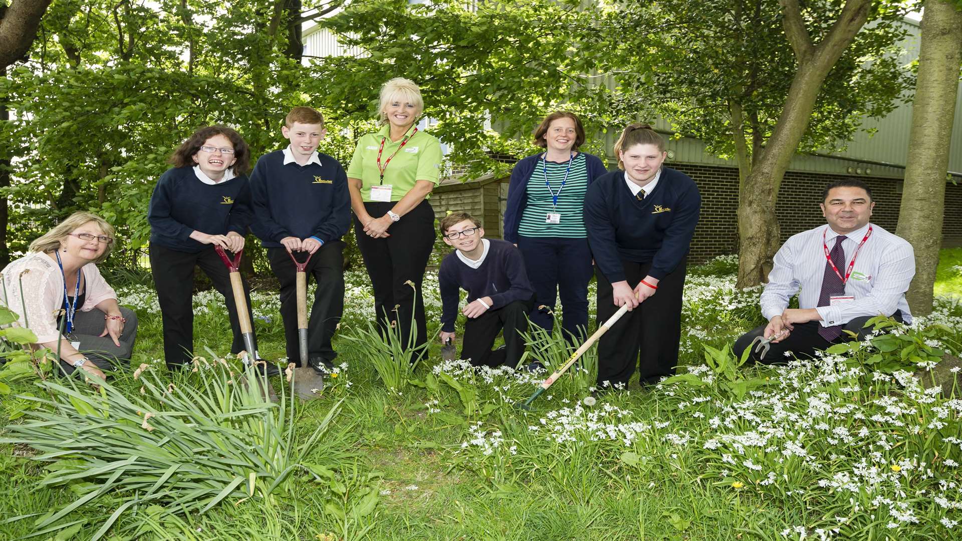 From left, Debbie Marsh, Mandy, 14, Darius, 13, Asda's Claire Fosbeary, Charlie, 14, Eleanor Matthews, Abbi, 13, and Asda's Dave Bassingthwaite