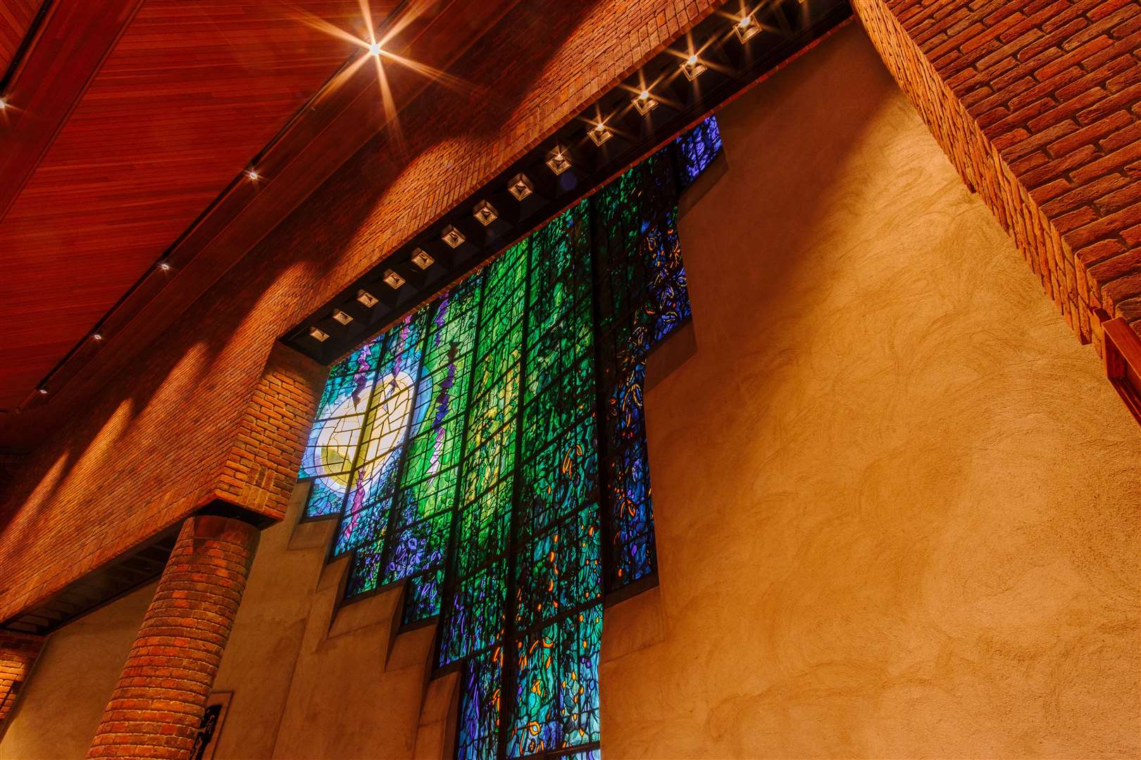 The chapel window at Cambridge’s Robinson College which has been listed at Grade II* (Historic England/PA)