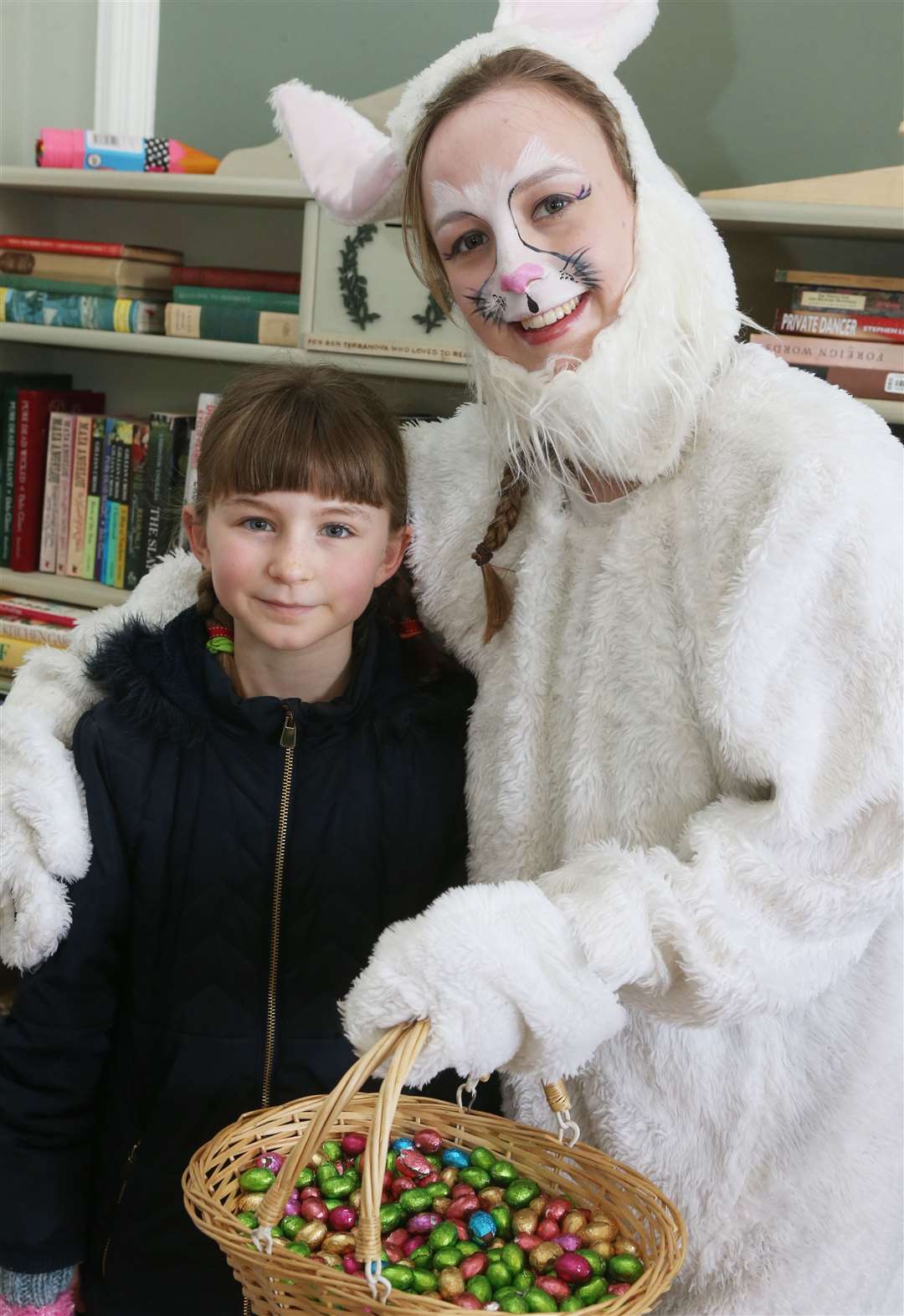 Elsie Harris cuddles up to Christy Wenban, at Kenward Trust's Walk on the Wild Side last year Picture: John Westhrop