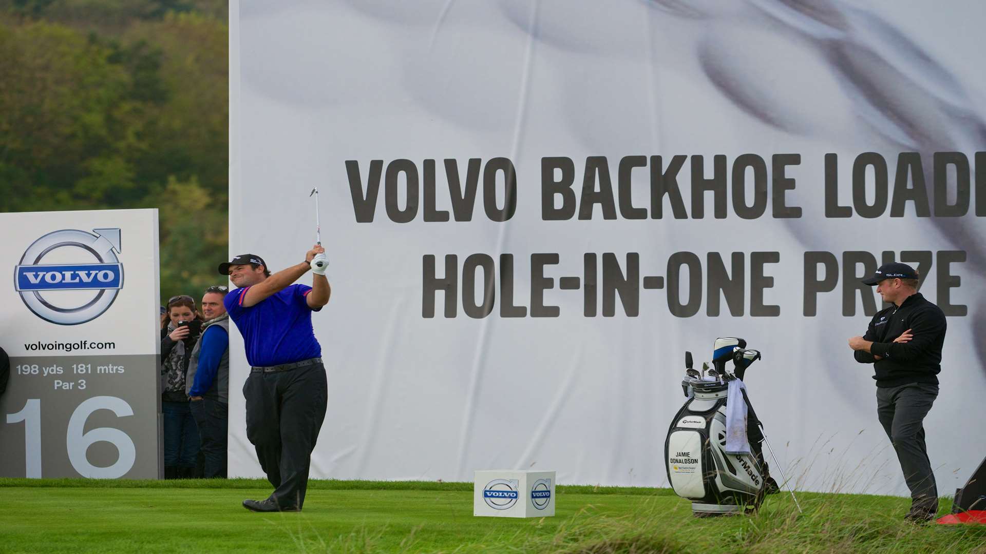 Patrick Reed tees off as Jamie Donaldson watches on Picture: Volvo in Golf