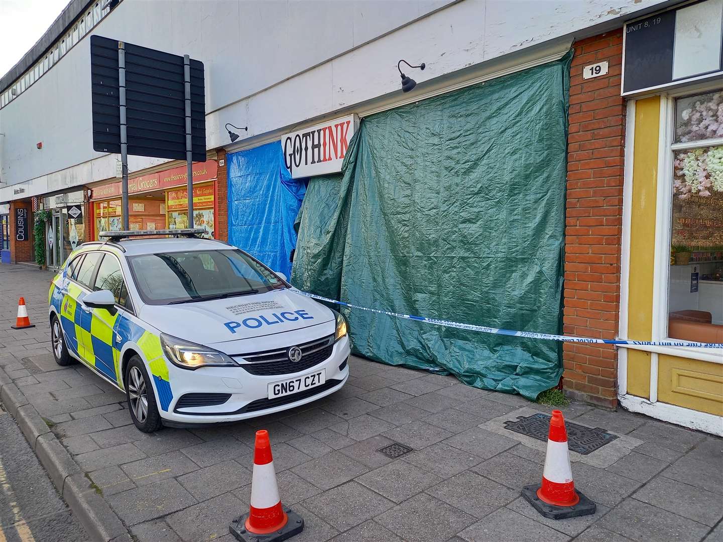 Police have blocked a tattoo and piercing shop in Lower Bridge Street