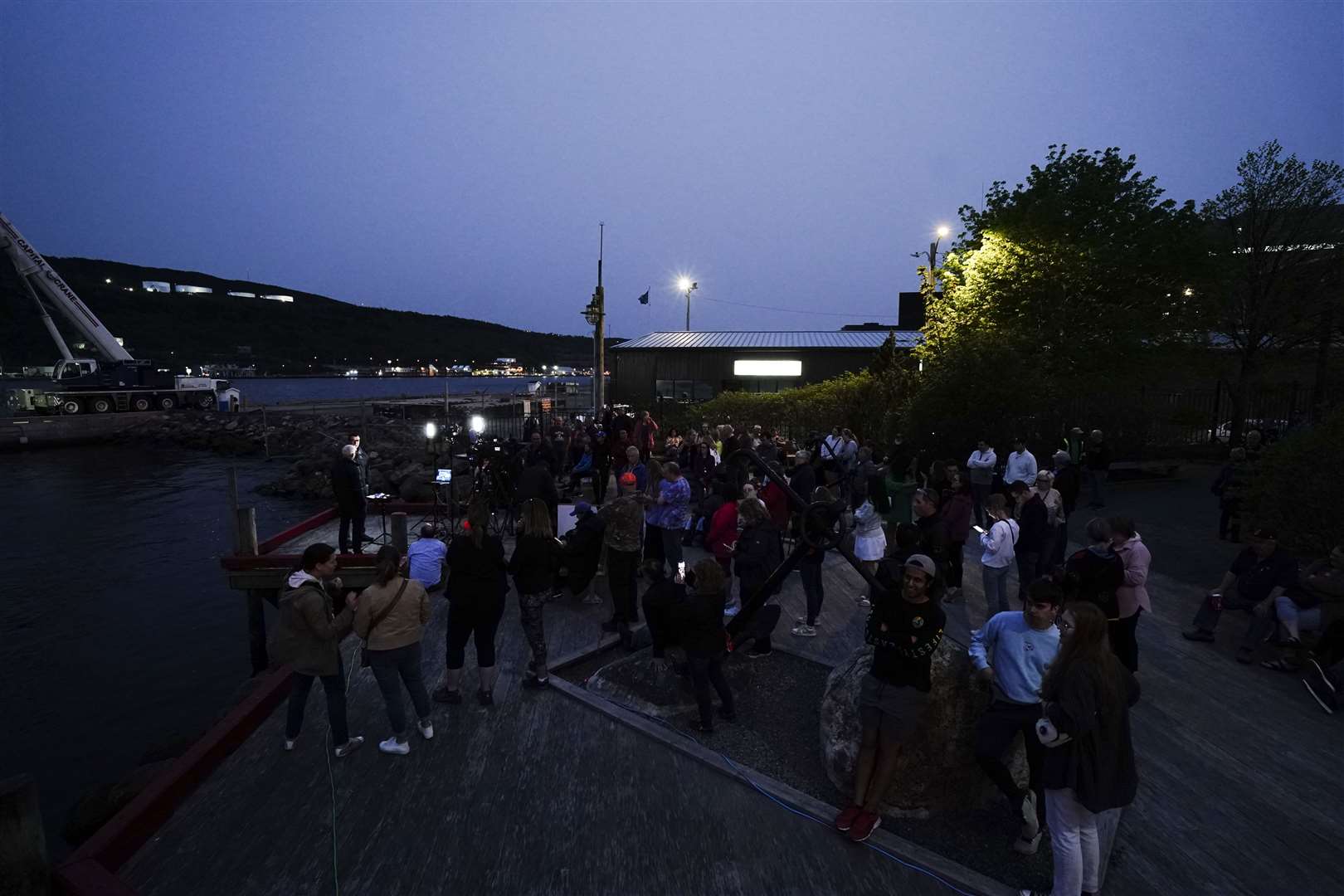 Members of the public line King’s Beach at St John’s Port as Canadian Coast Guard vessel Terry Fox, and Canadian vessel Skandi Vinland, return to St John’s Port in Newfoundland, Canada (Jordan Pettit/PA)