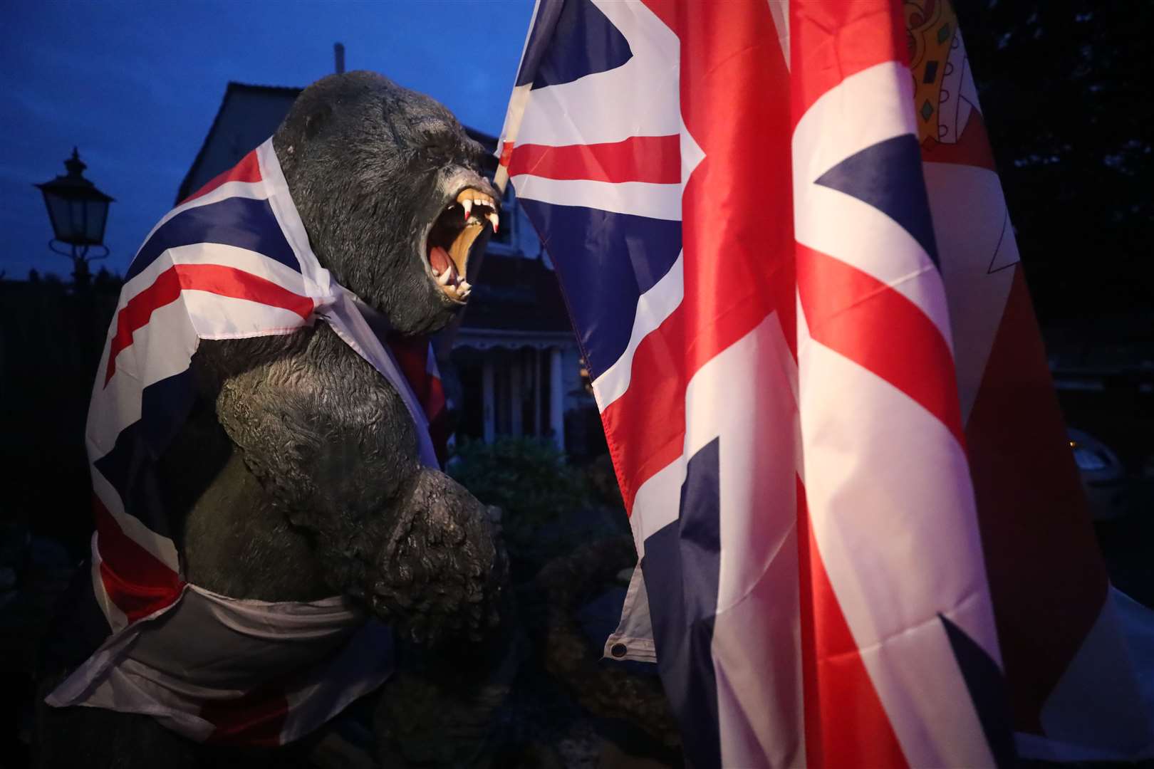 A plastic gorilla is wrapped in Union flag by a bonfire in Belfast’s Shankill Road (Niall Carson/PA)