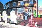 Brian and Ann Gilbert with their neighbour's son James Steel when the lights were switched on