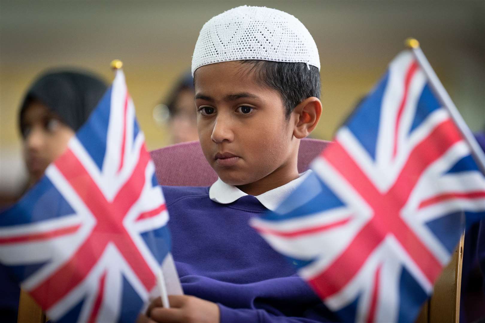 A child with Union flags (Stefan Rousseau/PA)