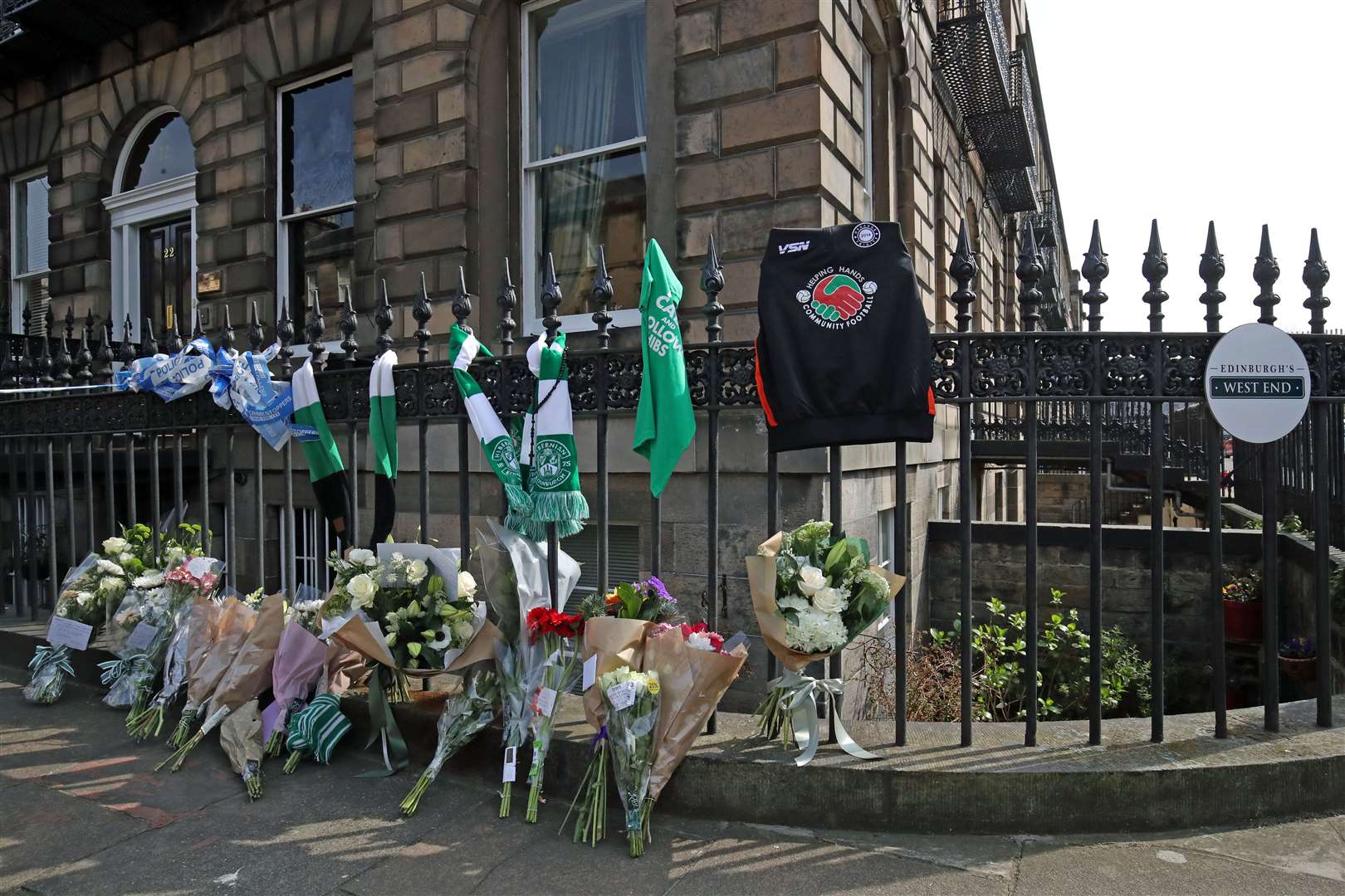 Floral tributes were left to Bradley Welsh near the scene of his shooting (PA)