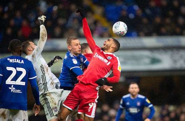 Mikael Mandron is challenged in the box by the keeper Will Norris Picture: Ady Kerry (25219313)